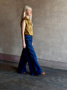 Image of woman wearing designer TWP Dillon cotton linen Denim in Dark Stone wash that is Made in USA with mid-rise and wide leg