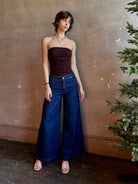 Woman wearing luxury designer TWP Dillon cotton linen Denim in Dark Stone wash that is Made in USA with mid-rise and wide leg
