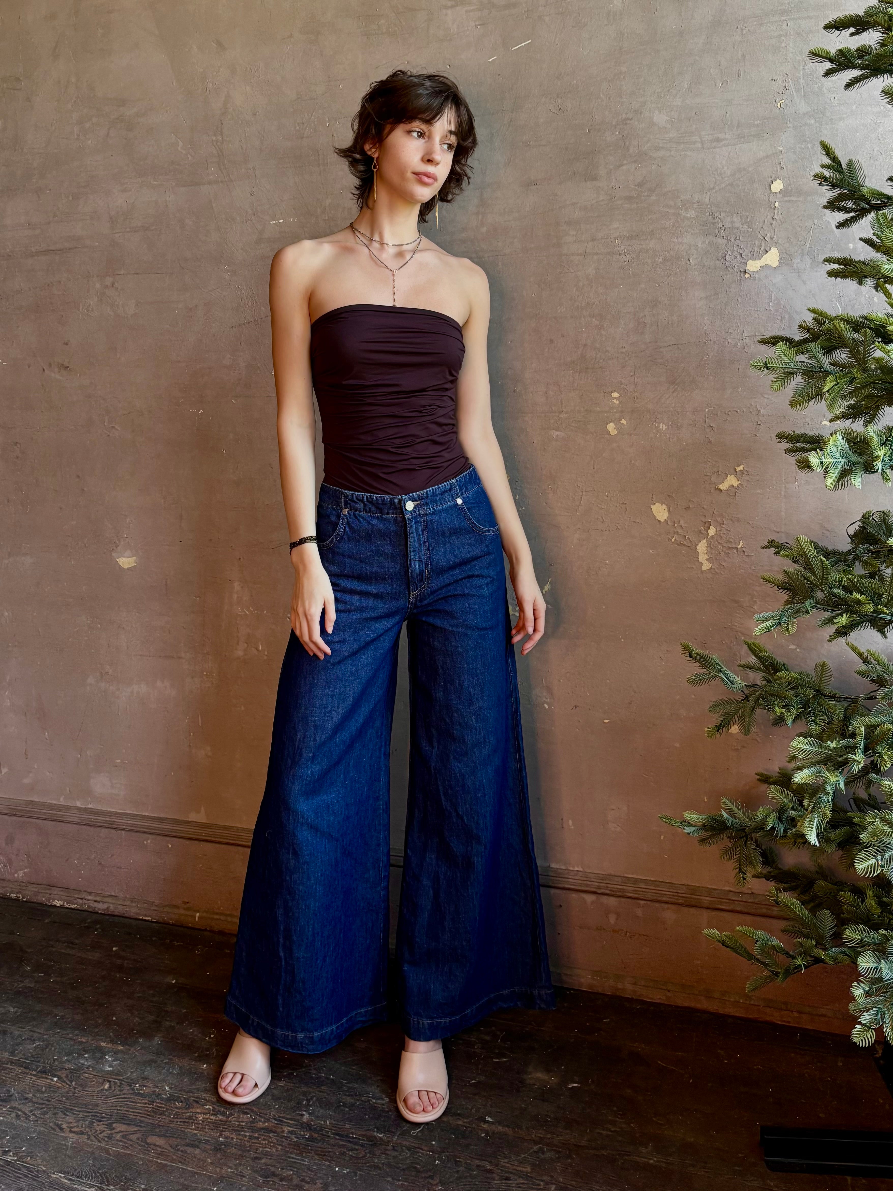 Woman wearing luxury designer TWP Dillon cotton linen Denim in Dark Stone wash that is Made in USA with mid-rise and wide leg