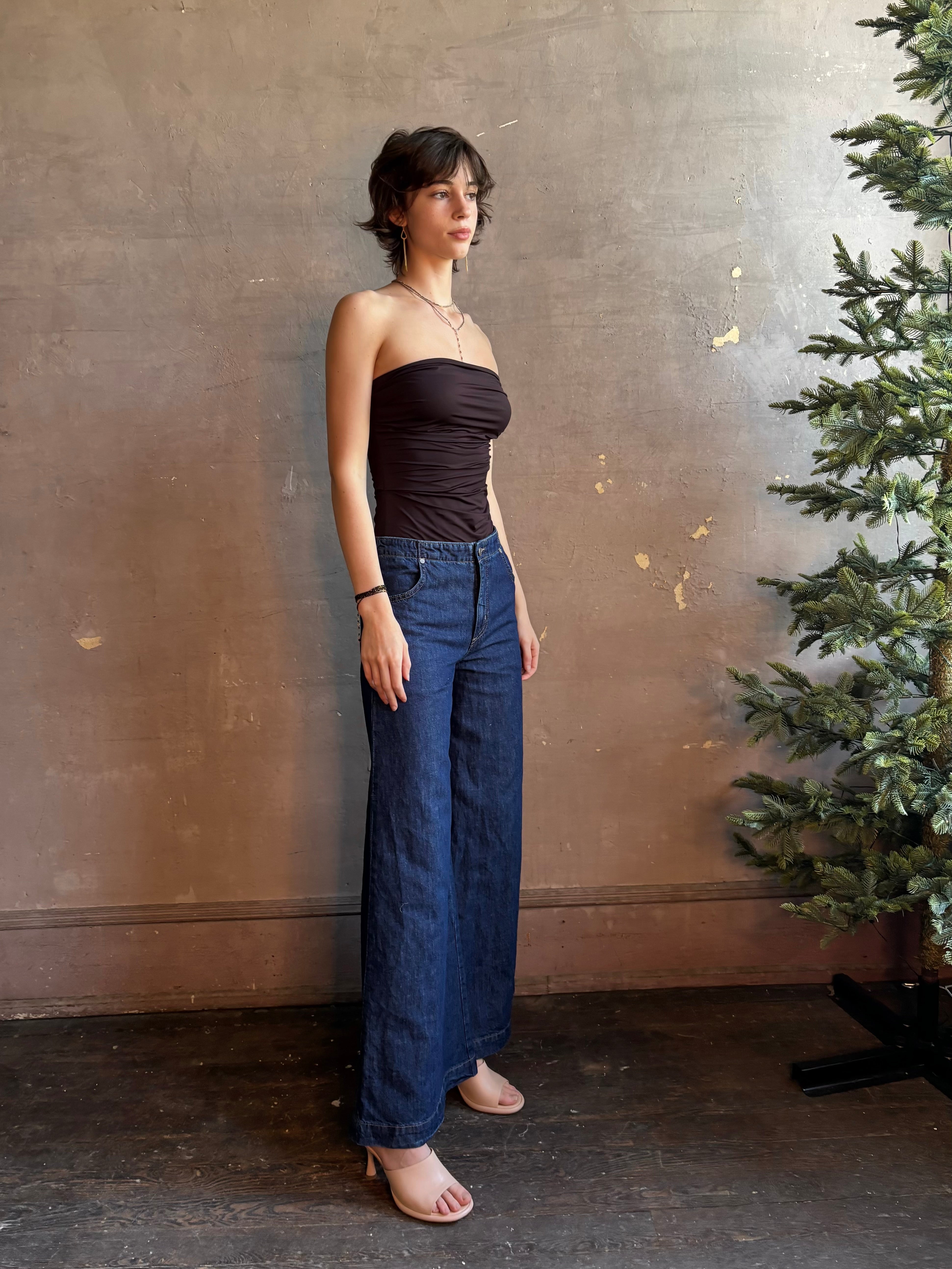 Woman wearing luxury designer TWP Dillon cotton linen Denim in Dark Stone wash that is Made in USA with mid-rise and wide leg