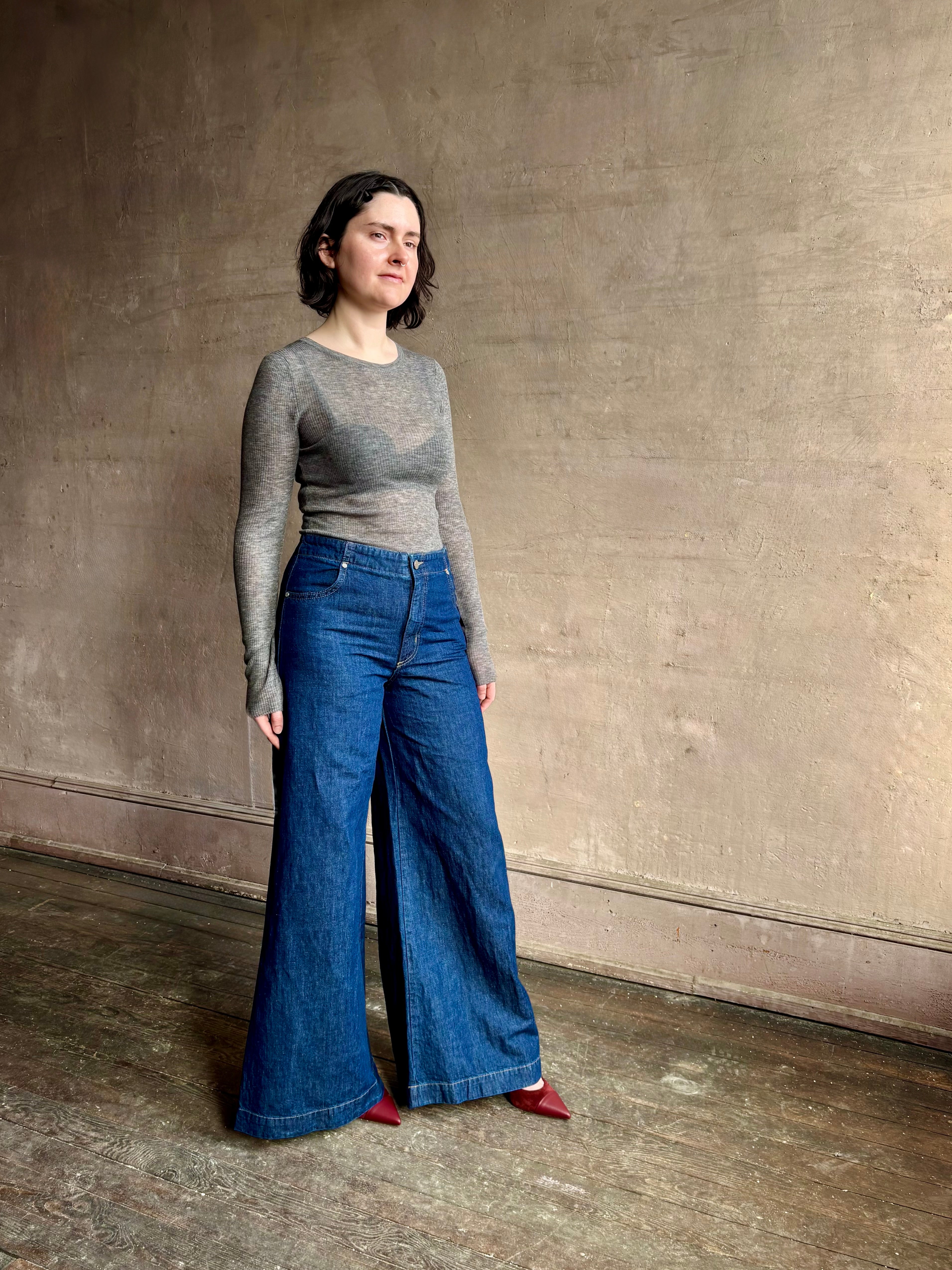 Image of woman wearing designer TWP Dillon cotton linen Denim in Dark Stone wash that is Made in USA with mid-rise and wide leg