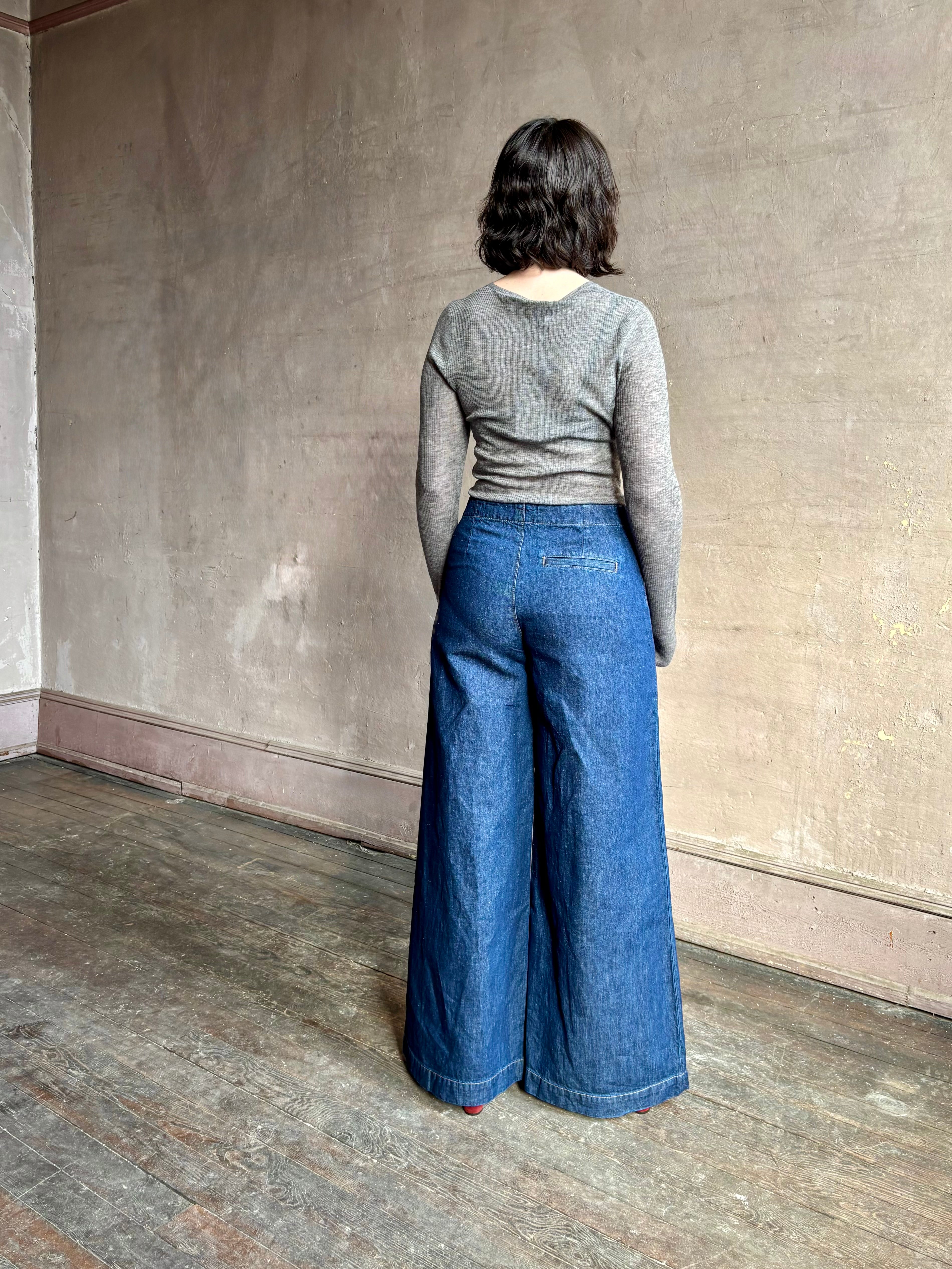 Image of woman wearing designer TWP Dillon cotton linen Denim in Dark Stone wash that is Made in USA with mid-rise and wide leg