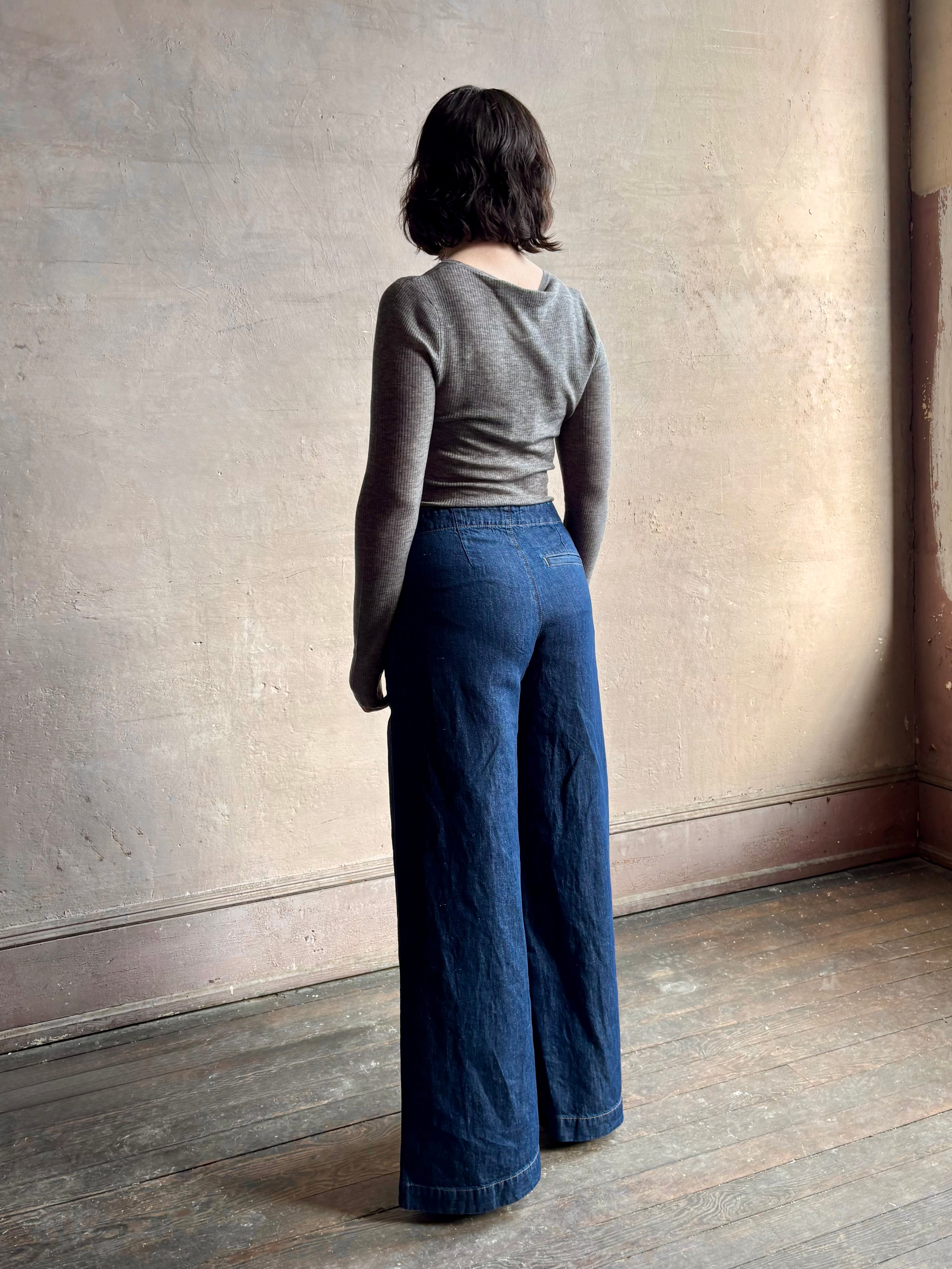 Image of woman wearing designer TWP Dillon cotton linen Denim in Dark Stone wash that is Made in USA with mid-rise and wide leg