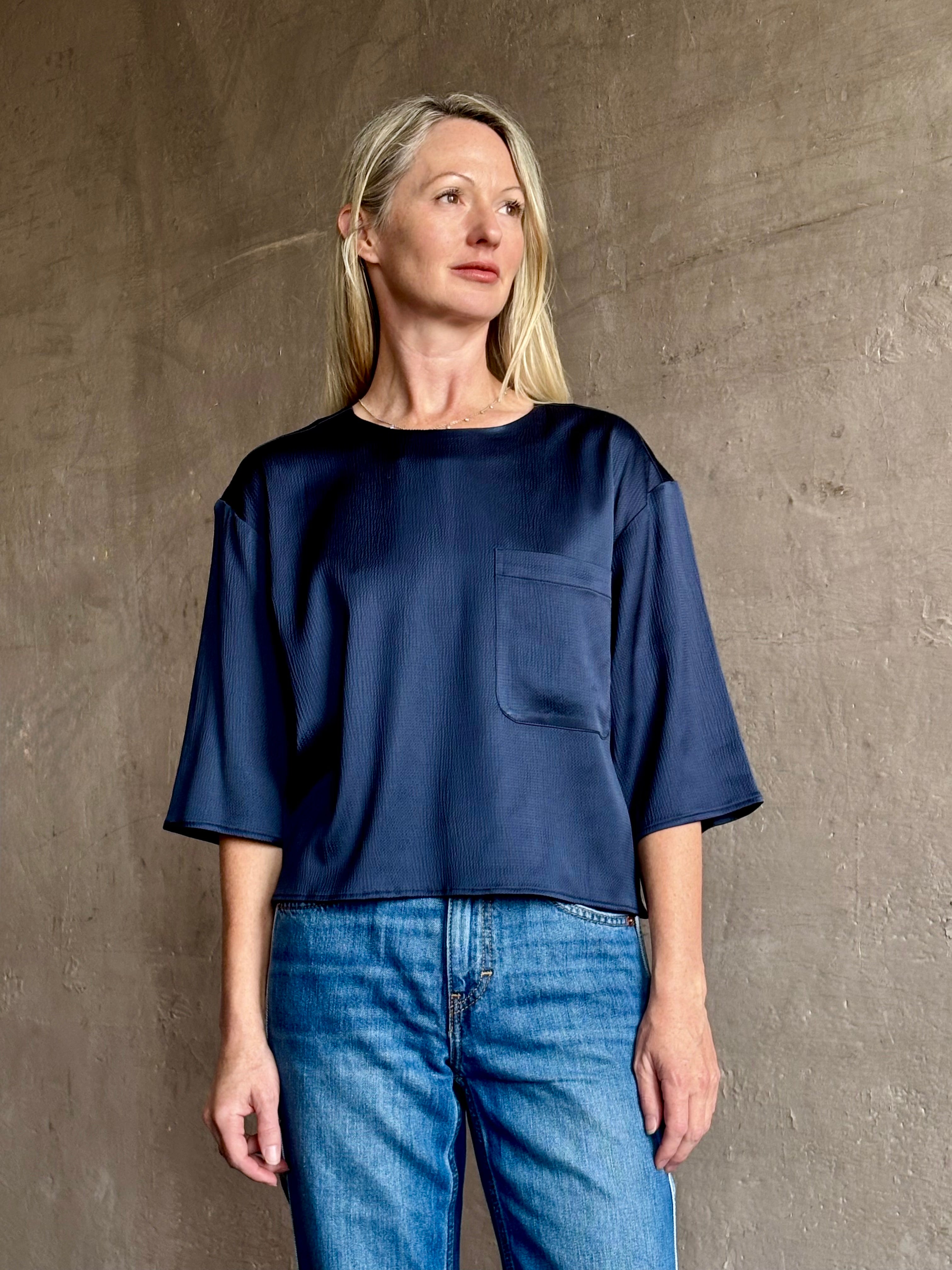 Mature woman wearing Women's luxury  clothing brand TWP Ex T hammered satin short sleeves crew neck navy blue