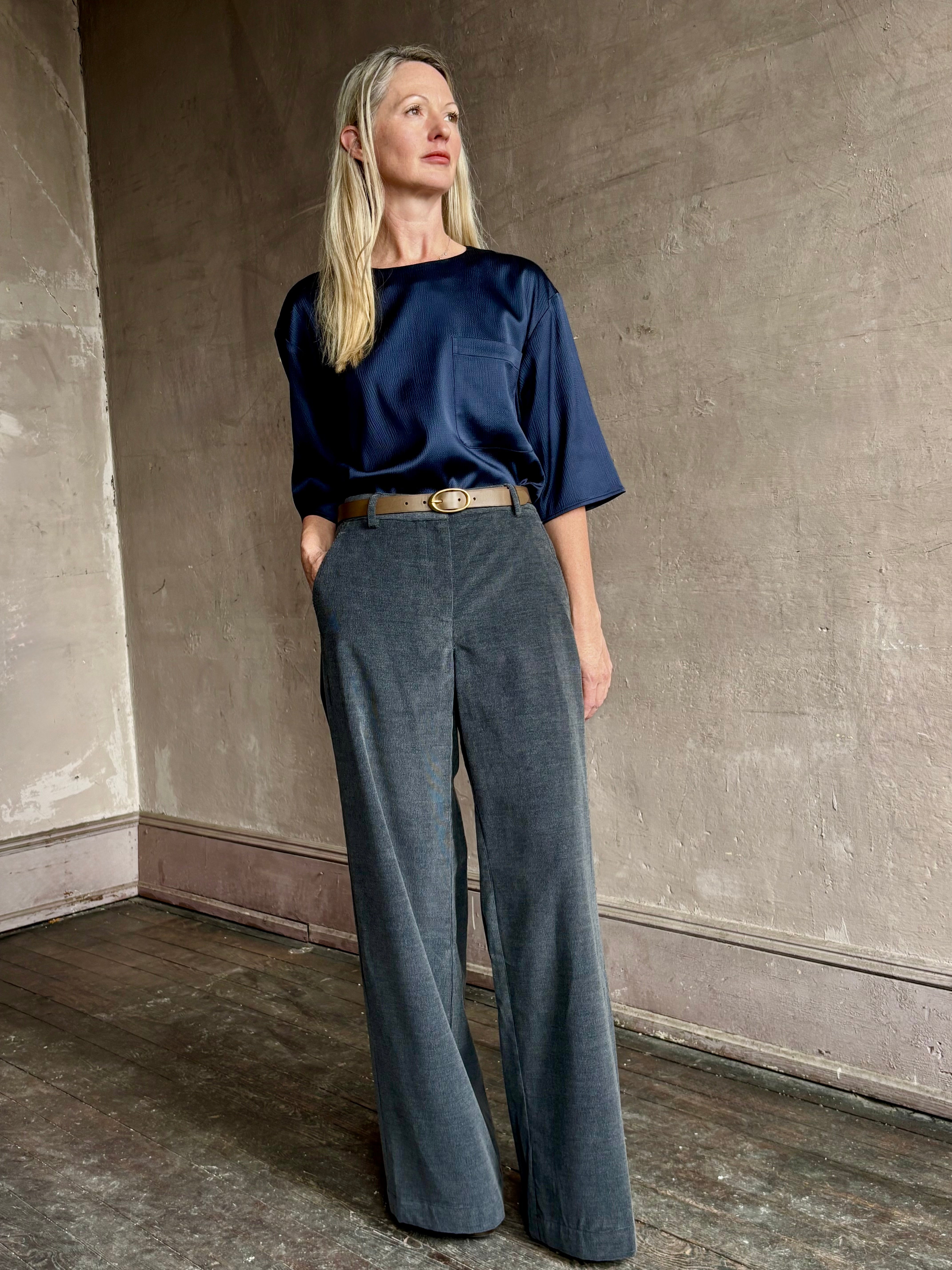 Image of mature woman wearing TWP Ex T in premium hammered satin with short sleeve crew neck and a casual front pocket