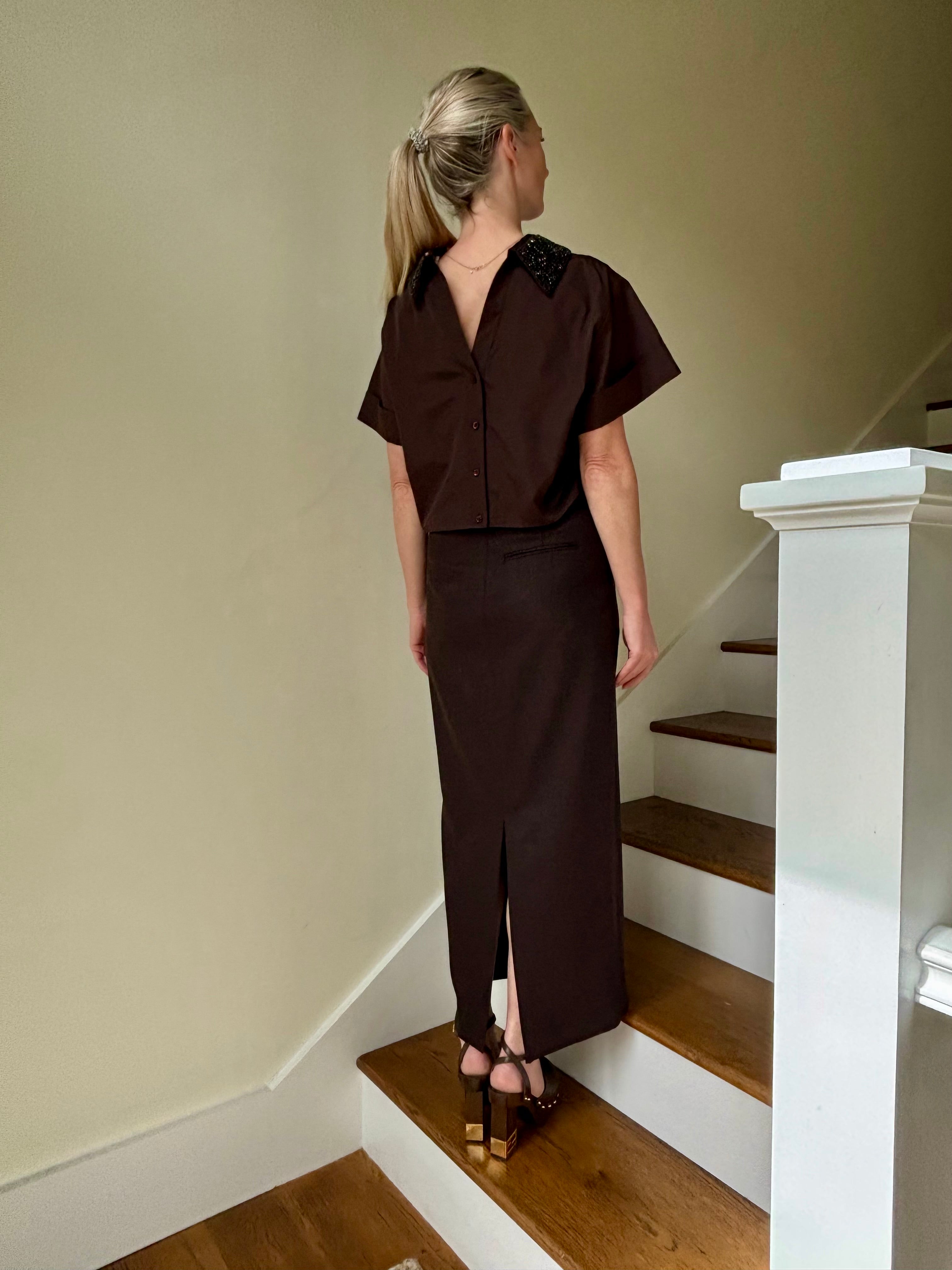 Image of mature woman wearing luxury TWP premium cotton blouse with a crystal collar in a rich chocolate color that's reversible