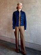 Image of woman wearing Premium Cotton American-Made Denim TWP Franny Shirt with feminine darting silhouette at waist