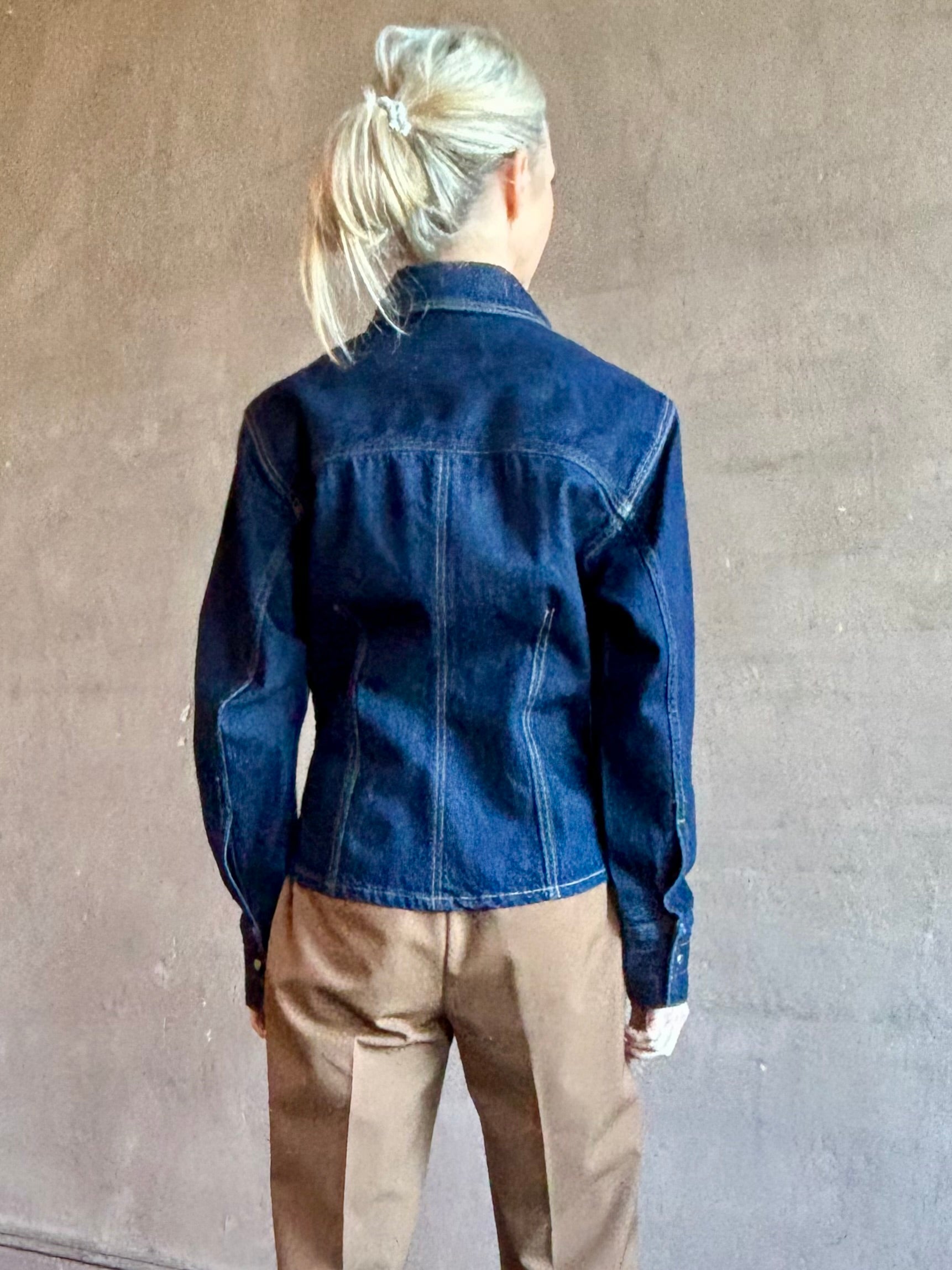 Image of woman wearing Premium Cotton American-Made Denim TWP Franny Shirt with feminine darting silhouette at waist