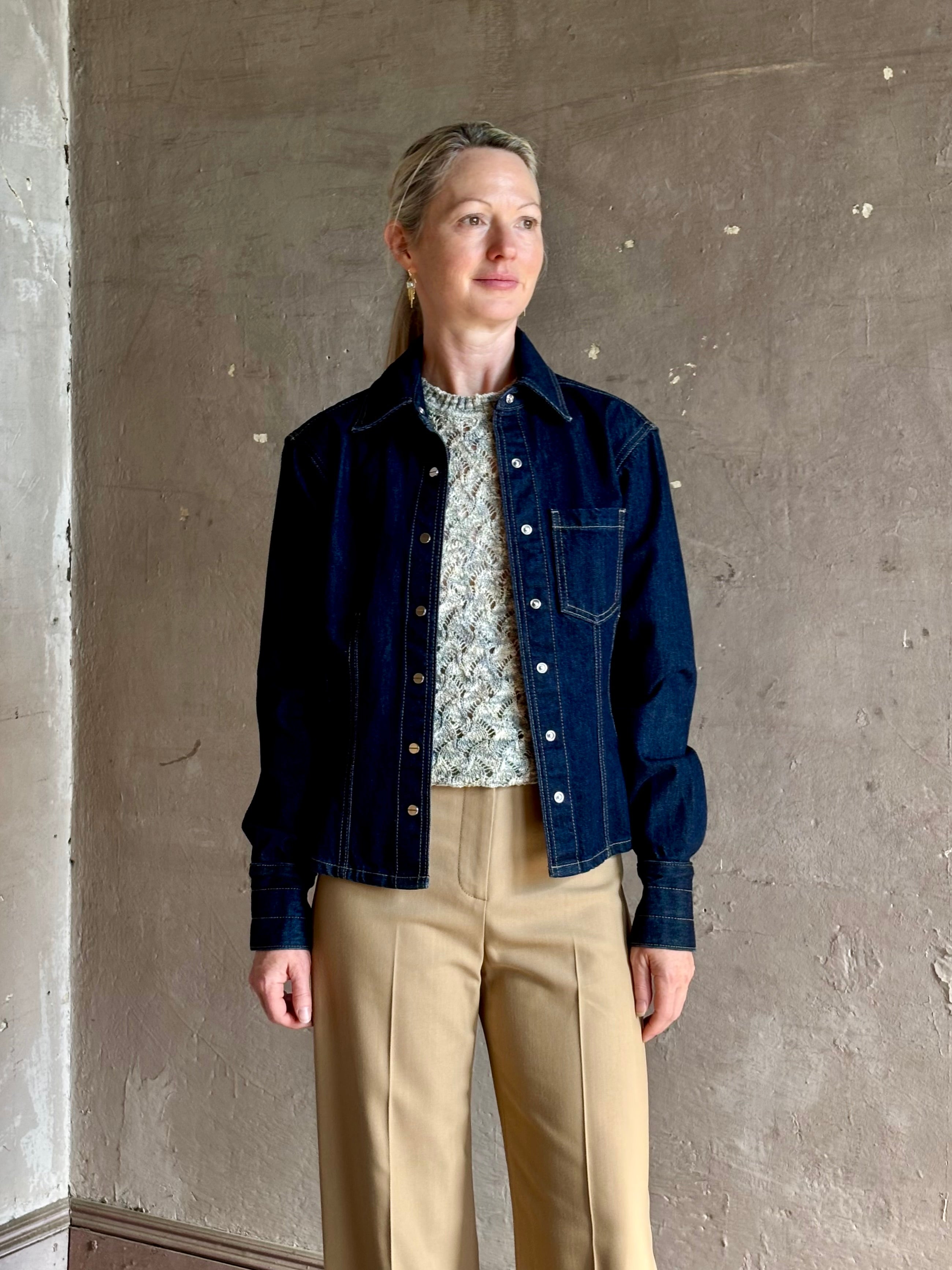 Mature woman wearing Premium Cotton American-Made Denim TWP Franny Shirt with feminine darting silhouette 