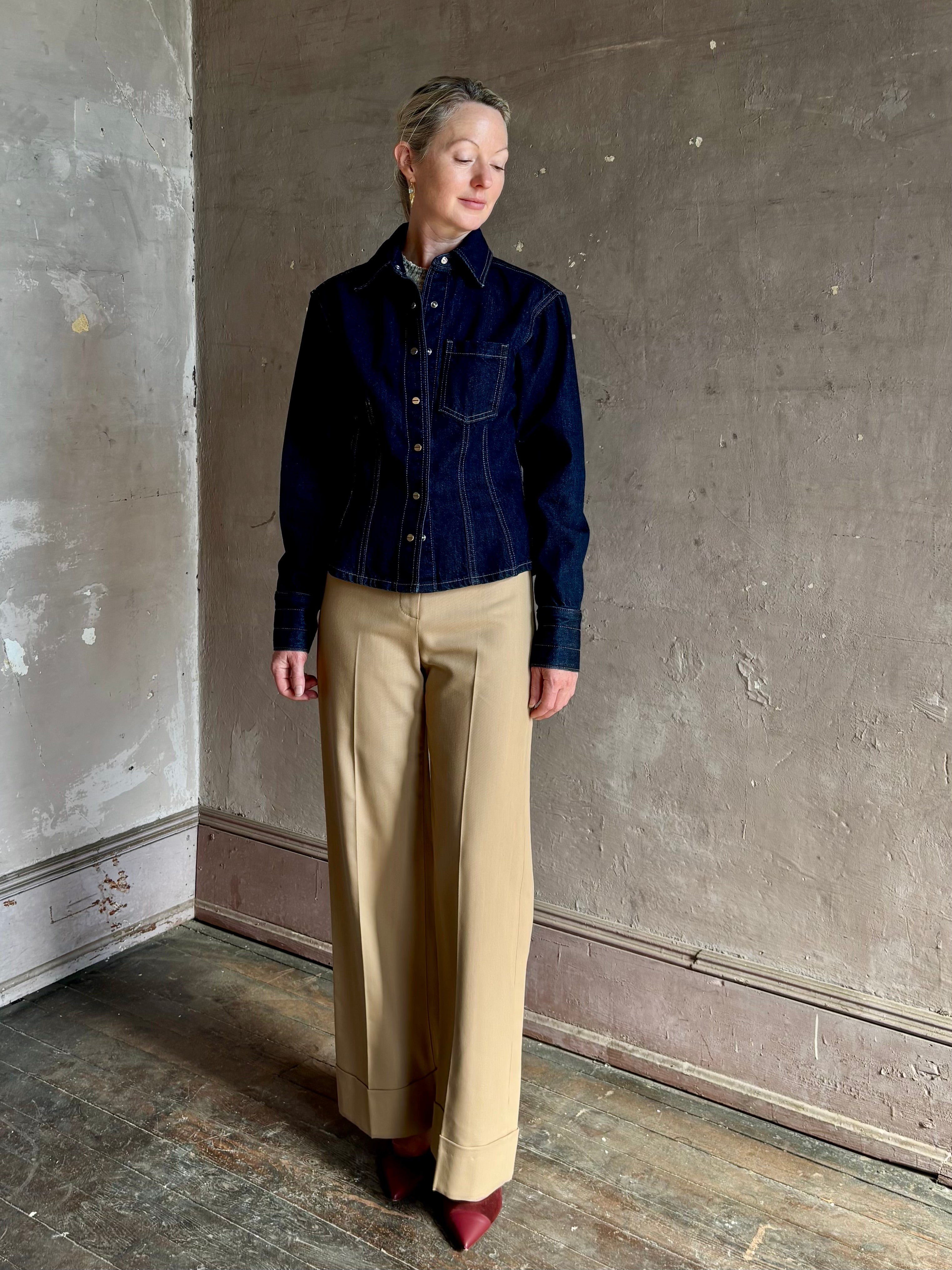 Mature woman wearing Premium Cotton American-Made Denim TWP Franny Shirt with feminine darting silhouette 