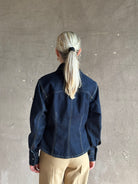 Mature woman wearing Premium Cotton American-Made Denim TWP Franny Shirt with feminine darting silhouette 