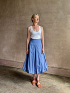 Mature woman wearing American made cotton poplin TWP blue plaid Full Intentions midi bubble Skirt with drop waist
