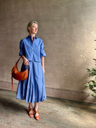 Mature woman wearing American made cotton poplin TWP blue plaid Full Intentions midi bubble Skirt with drop waist