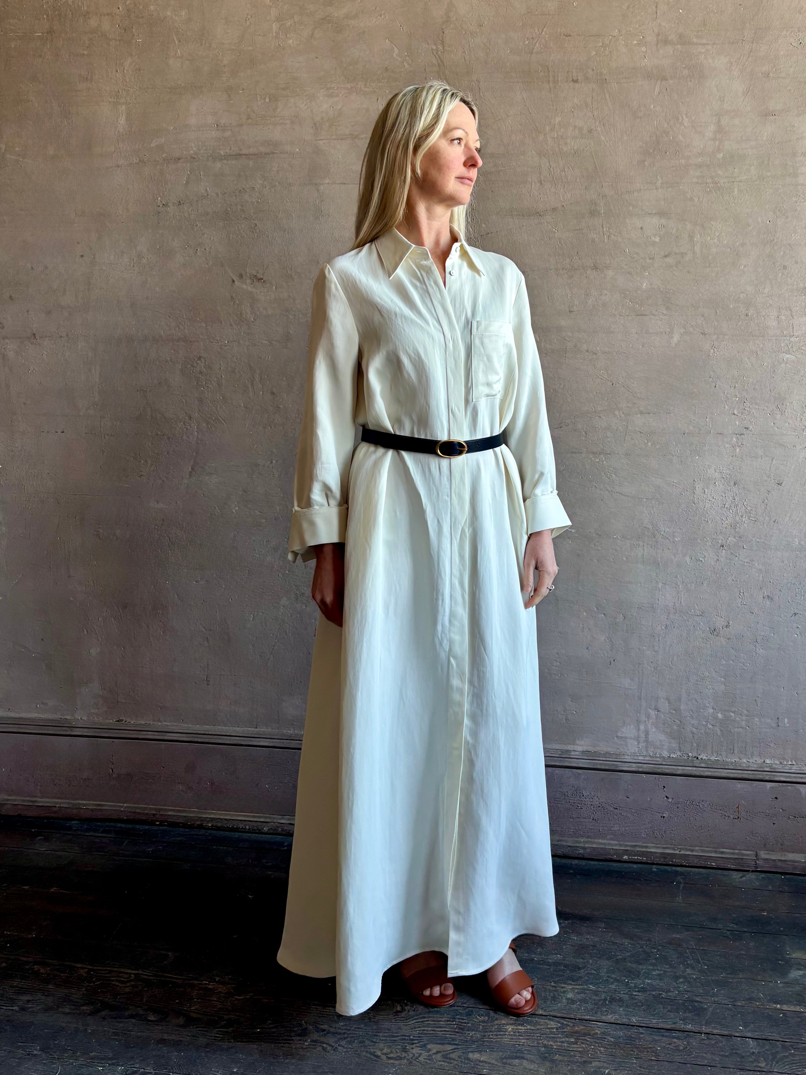 Mature Woman wearing Jenny's Gown from TWP is a women's designer floor length gown rendered in a soft bone hue crafted from a luxurious blend of viscose and linen