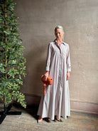 Mature woman wearing luxury TWP Jenny's Gown in Brown Stripe effortless sophistication in a comfortable premium cotton