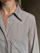 Mature woman wearing luxury TWP Jenny's Gown in Brown Stripe effortless sophistication in a comfortable premium cotton