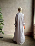 Mature woman wearing luxury TWP Jenny's Gown in Brown Stripe effortless sophistication in a comfortable premium cotton