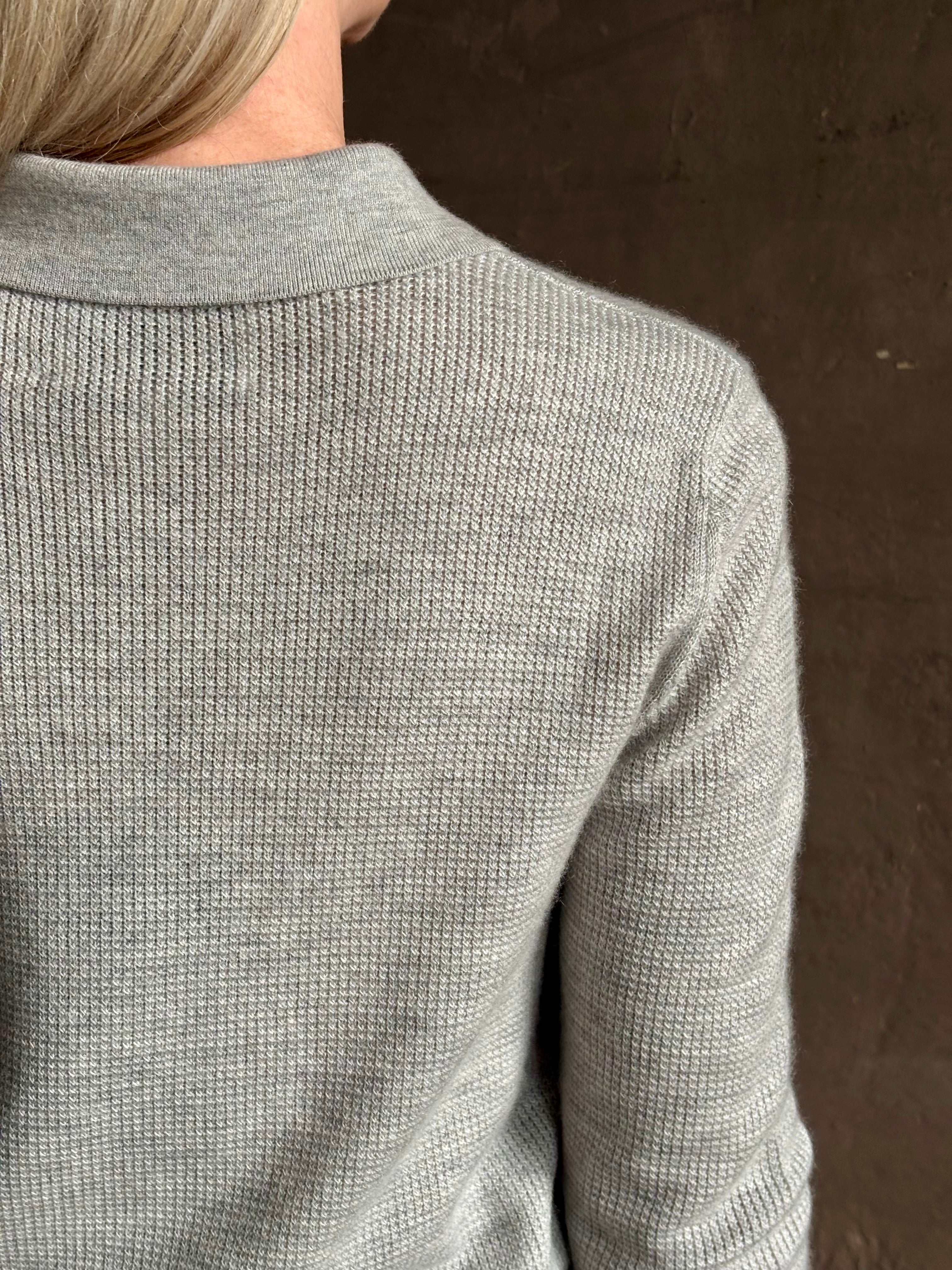 woman wearing light heather grey TWP Jorden Polo Henley premium cashmere  elevated casual wear comfy long sleeve