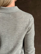 woman wearing light heather grey TWP Jorden Polo Henley premium cashmere  elevated casual wear comfy long sleeve