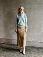 woman wearing light heather grey TWP Jorden Polo Henley premium cashmere  elevated casual wear comfy long sleeve