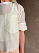 Mature woman wearing TWP New Ex T top in an Ivory lightweight cotton silk blend with short sleeves crew neck 