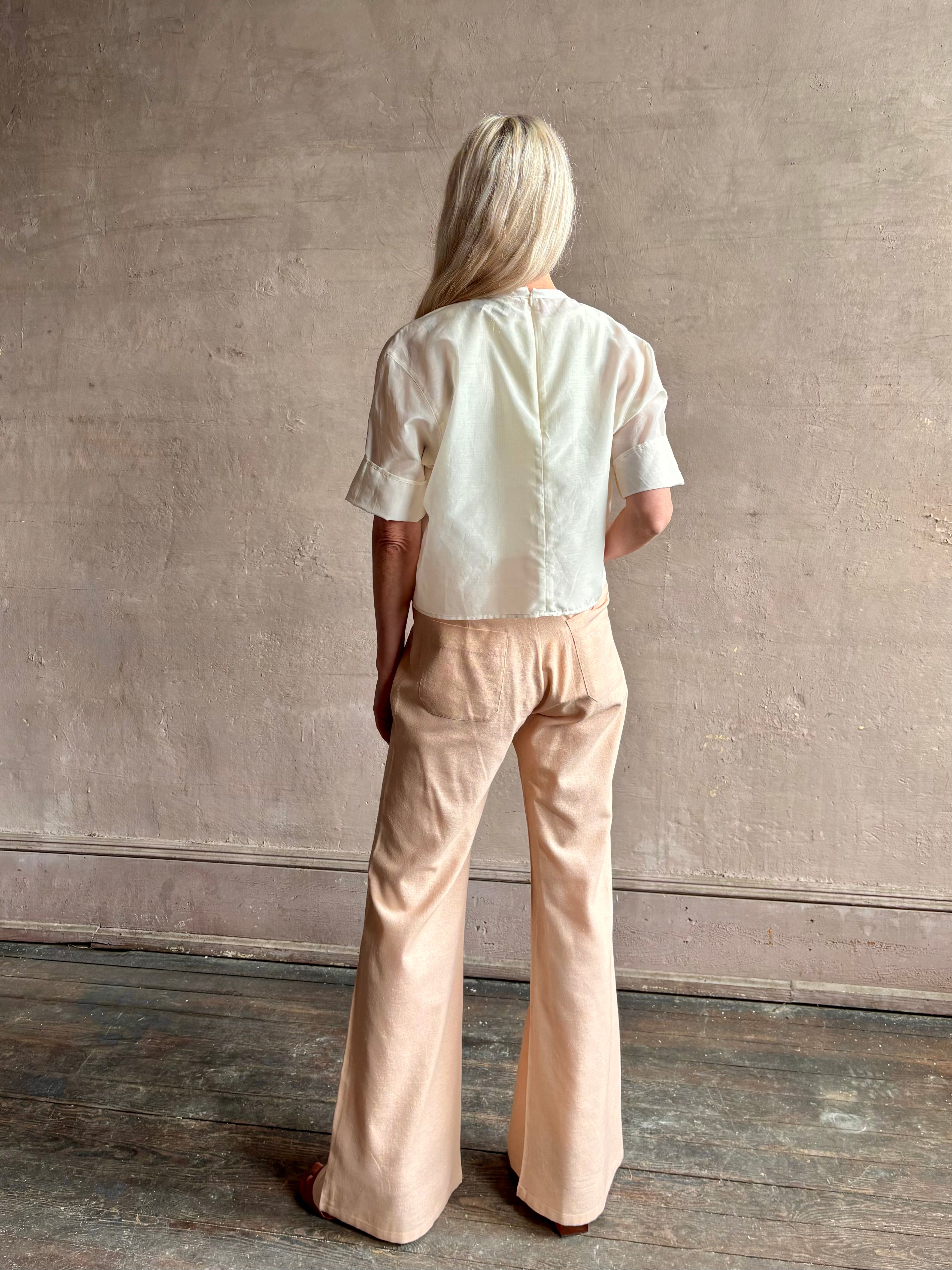 Mature woman wearing TWP New Ex T top in an Ivory lightweight cotton silk blend with short sleeves crew neck 
