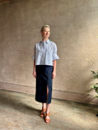 Woman wearing luxury cotton poplin TWP Next EX Shirt White and navy stripe with collar button front made in USA