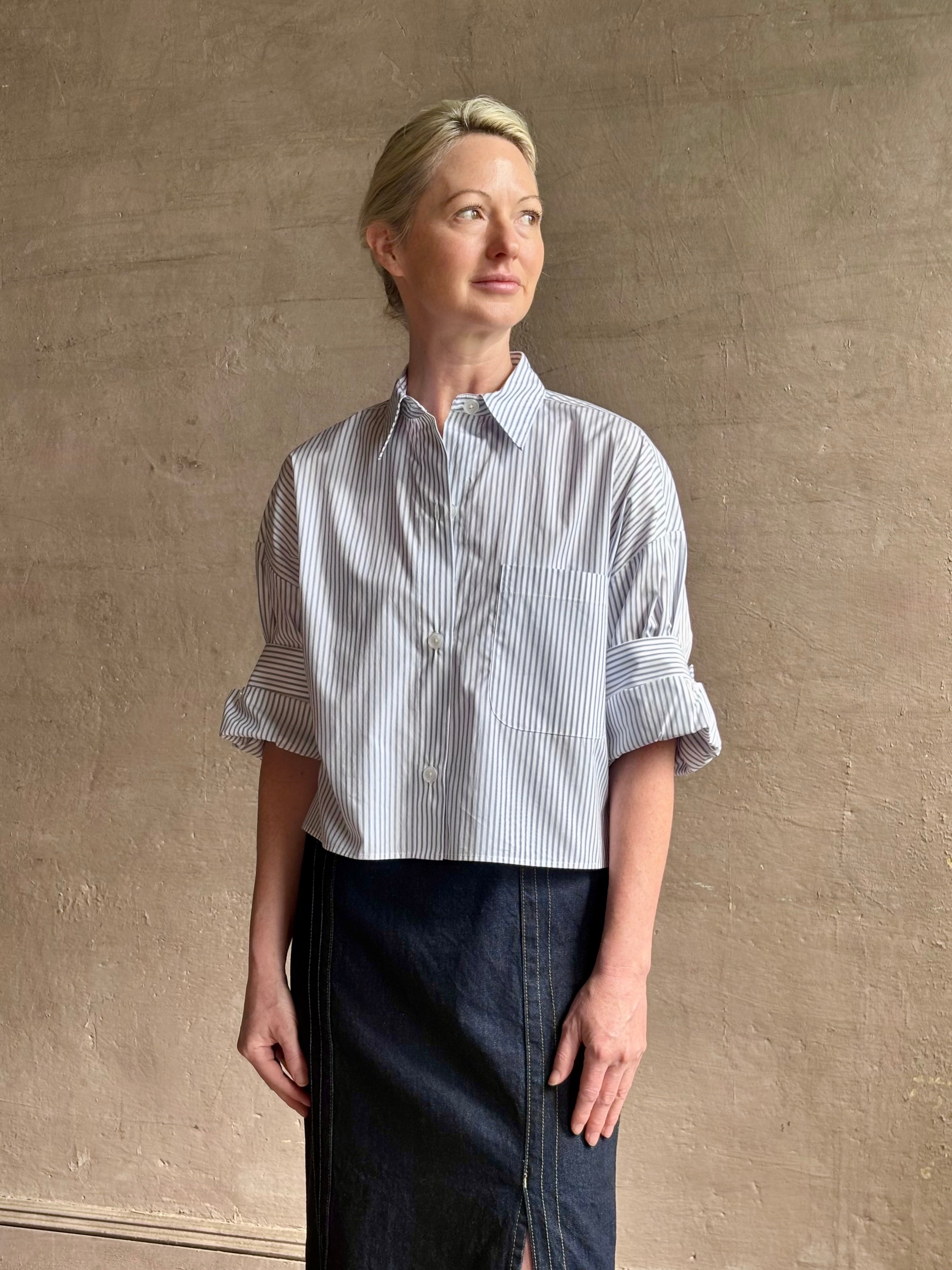 Woman wearing luxury cotton poplin TWP Next EX Shirt White and navy stripe with collar button front made in USA
