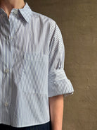Woman wearing luxury cotton poplin TWP Next EX Shirt White and navy stripe with collar button front made in USA