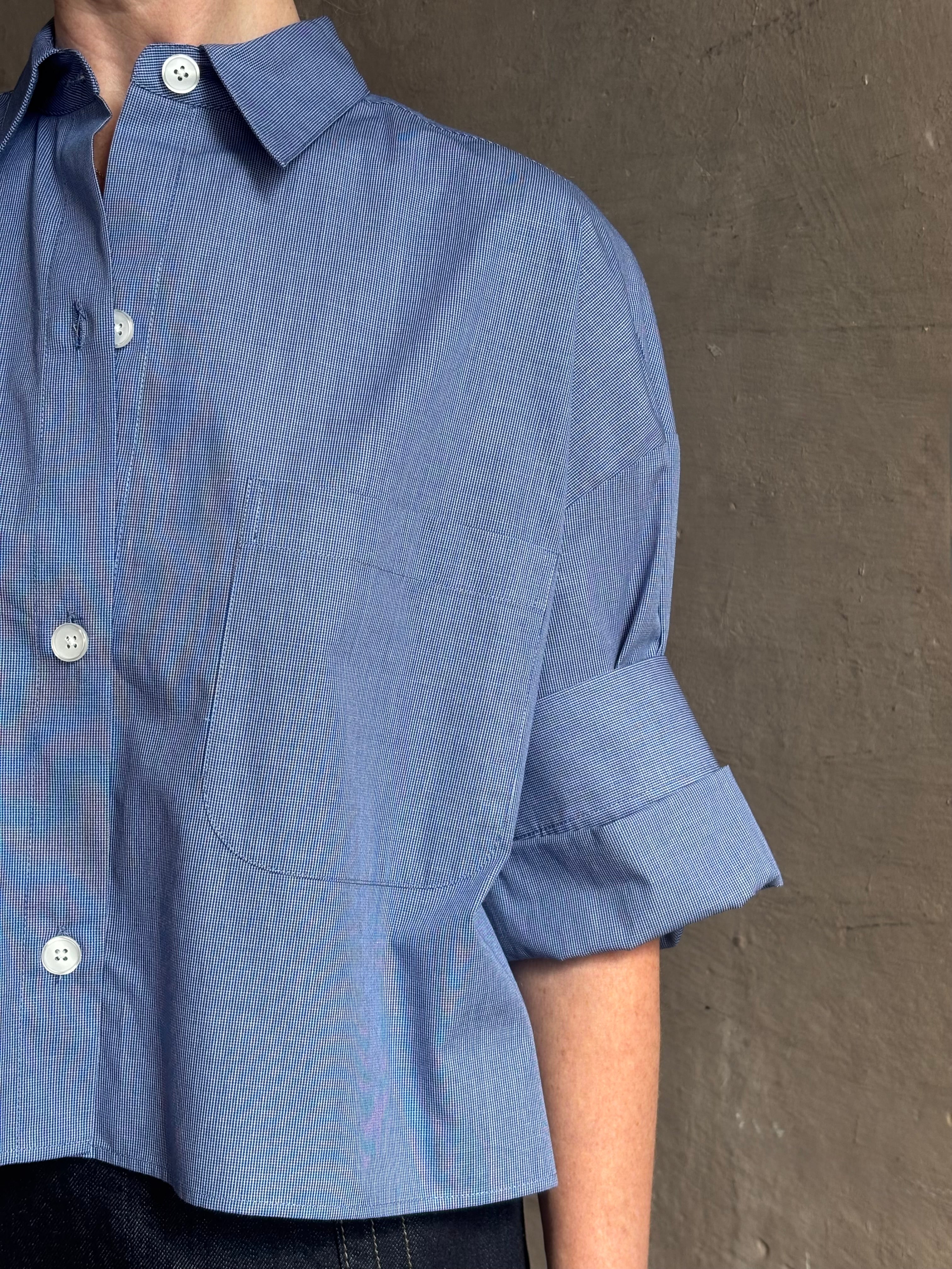 mature model wearing classic cotton poplin button down next ex top by luxury brand TWP in a blue and white 