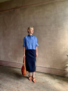 mature model wearing classic cotton poplin button down next ex top by luxury brand TWP in a blue and white 