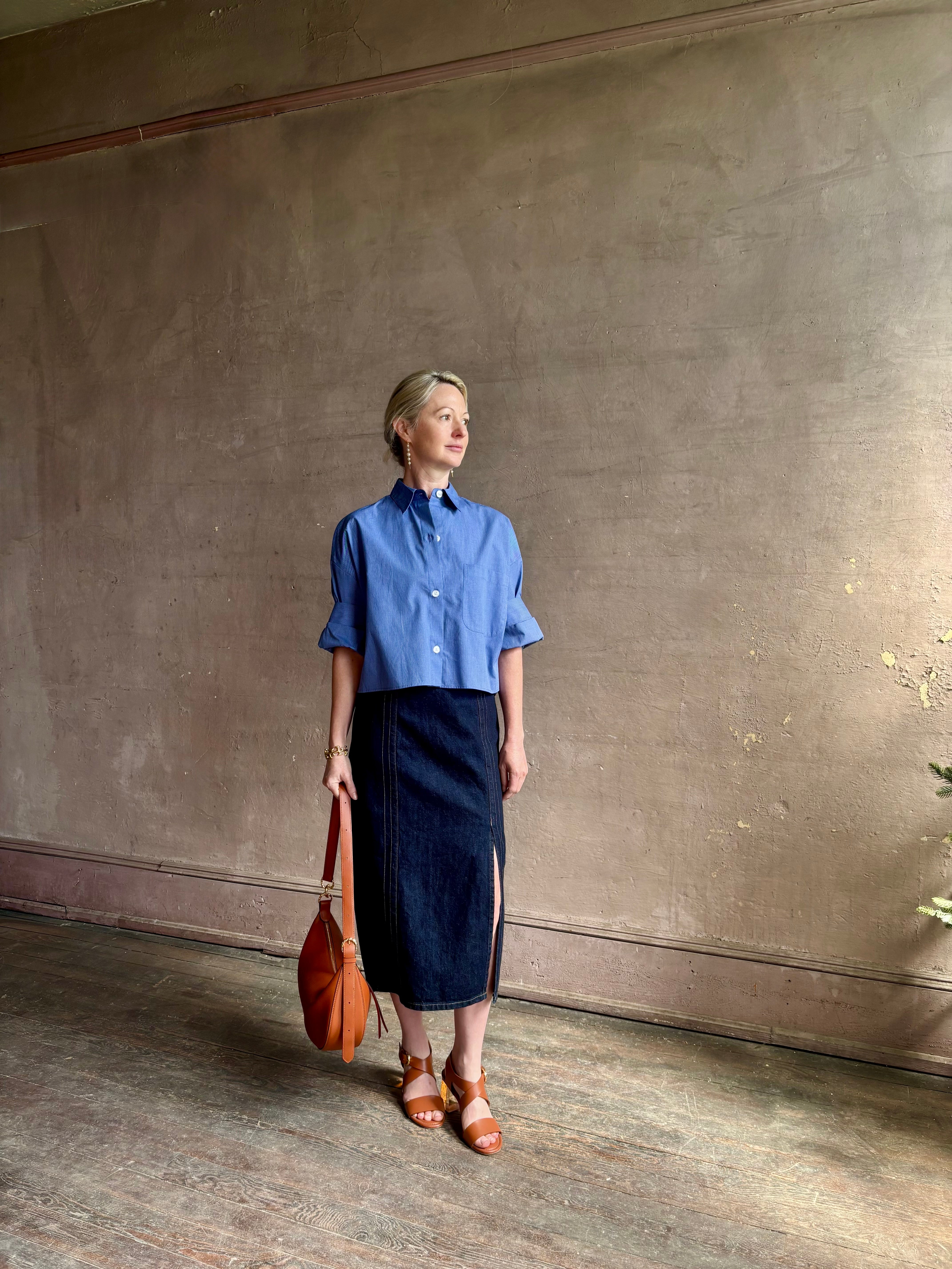 mature model wearing classic cotton poplin button down next ex top by luxury brand TWP in a blue and white 