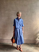 mature model wearing classic cotton poplin button down next ex top by luxury brand TWP in a blue and white 