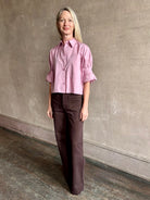 Woman wearing premium cotton TWP Next EX button up cropped shirt with half sleeve in lilac and made in USA