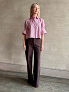 Woman wearing premium cotton TWP Next EX button up cropped shirt with half sleeve in lilac and made in USA