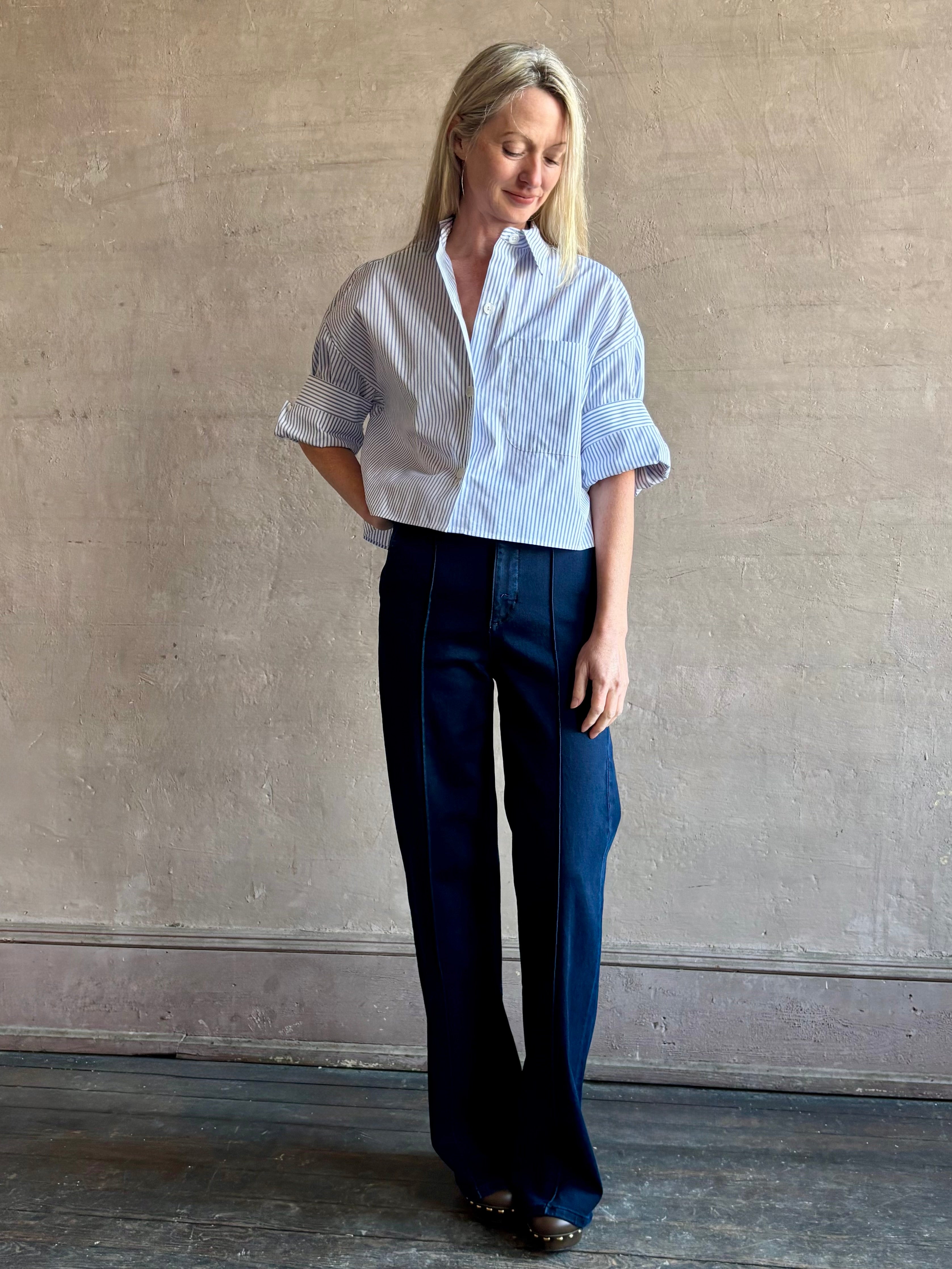 Woman wearing premium cotton poplin TWP Next EX Shirt in White and navy stripe with collar and button front made in USA