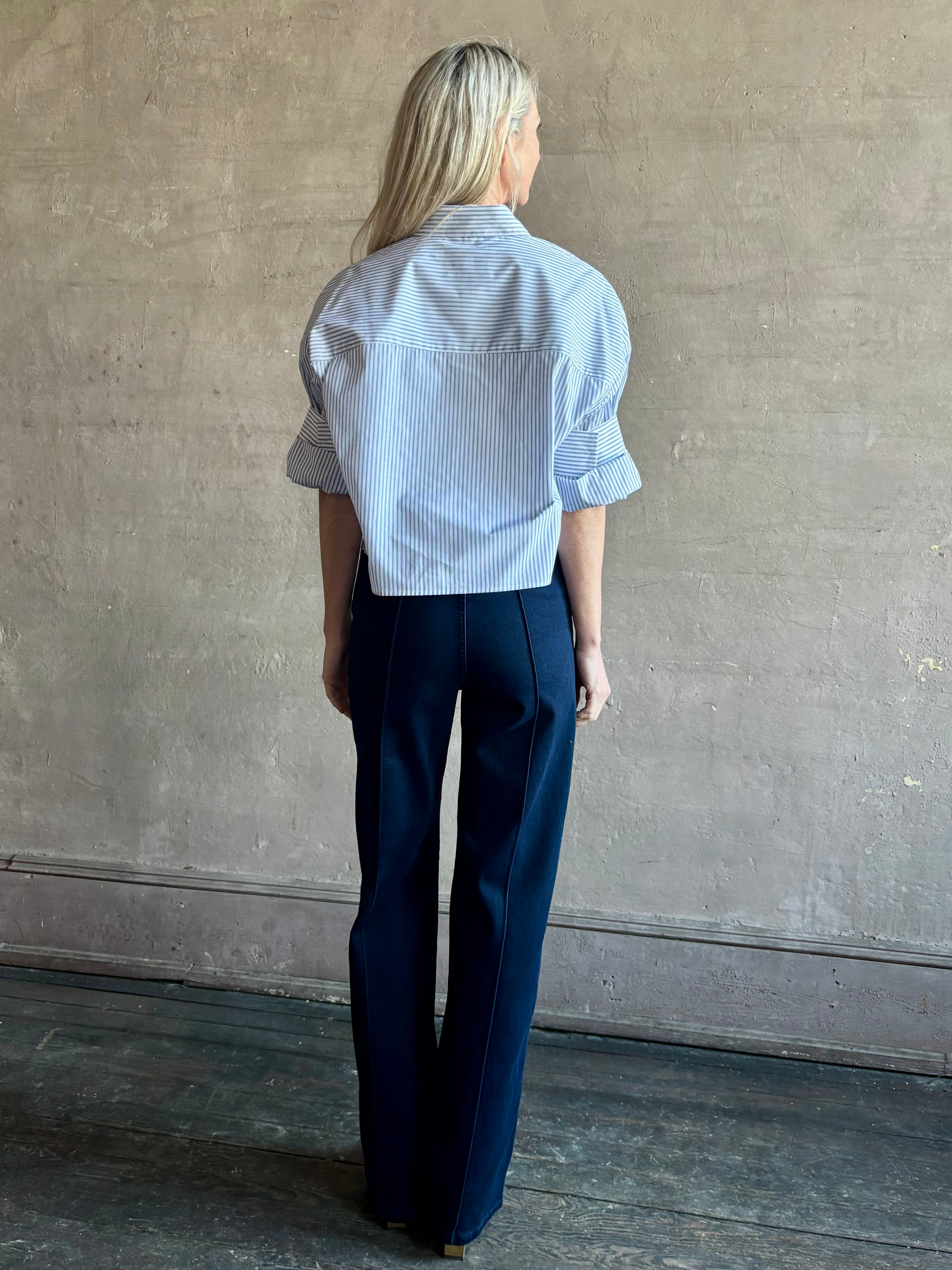 Woman wearing premium cotton poplin TWP Next EX Shirt in White and navy stripe with collar and button front made in USA