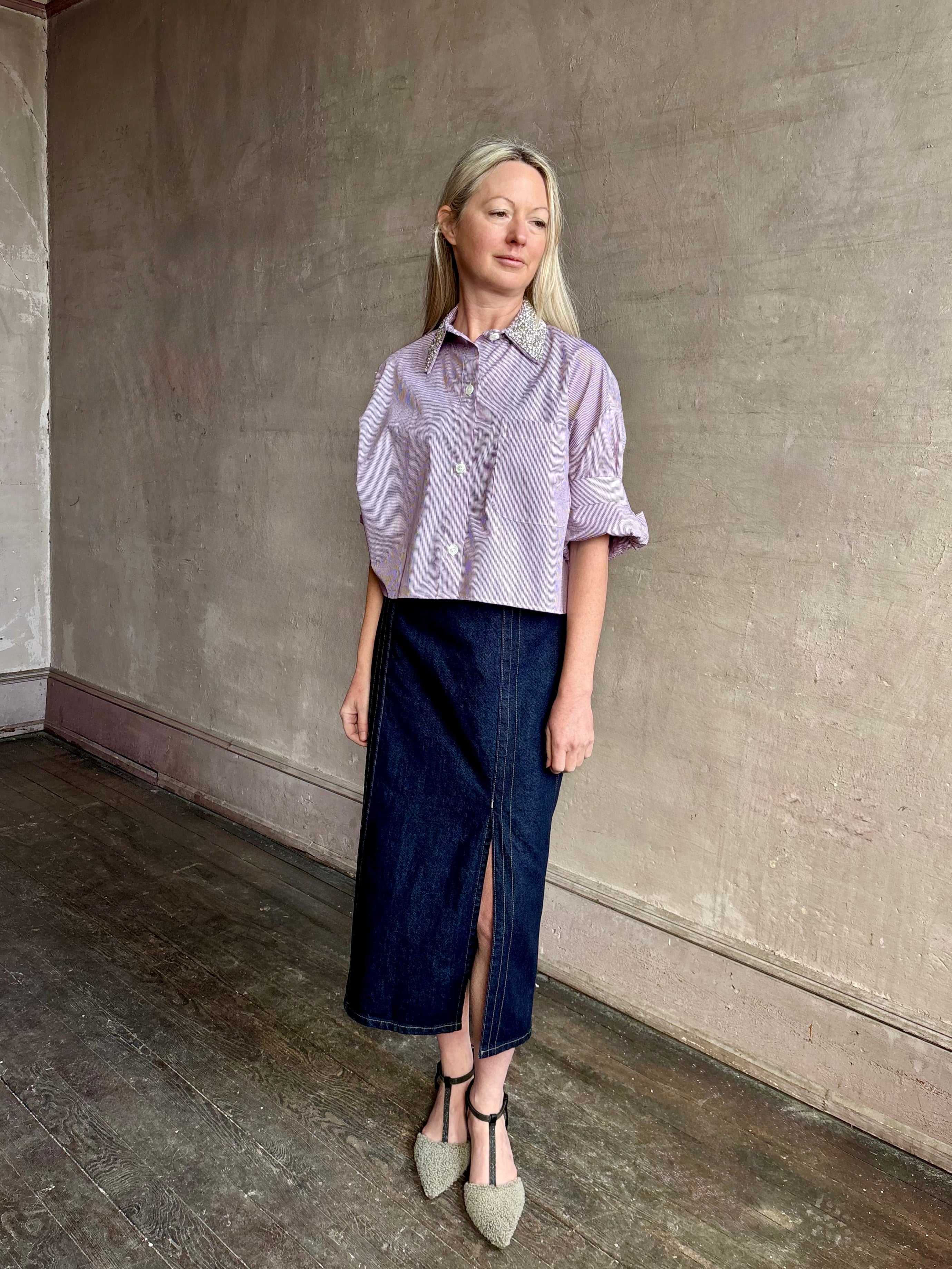 Image of mature woman wearing American made TWP Next EX cotton shirt with elevated Crystal embellished Collar in White and wine stripe 