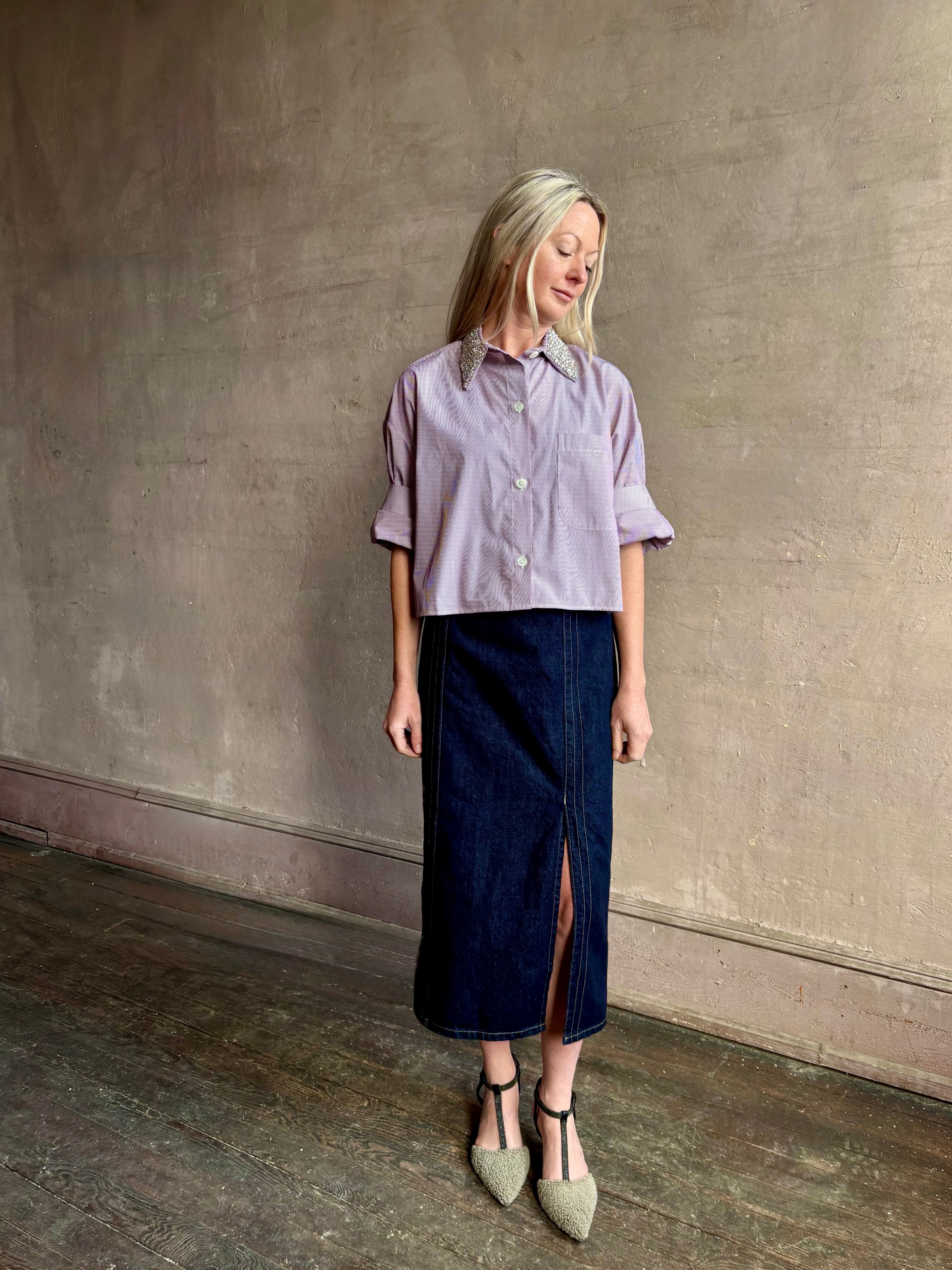Image of mature woman wearing designer TWP Next EX cotton shirt with elevated Crystal embellished Collar in a White and wine stripe button down