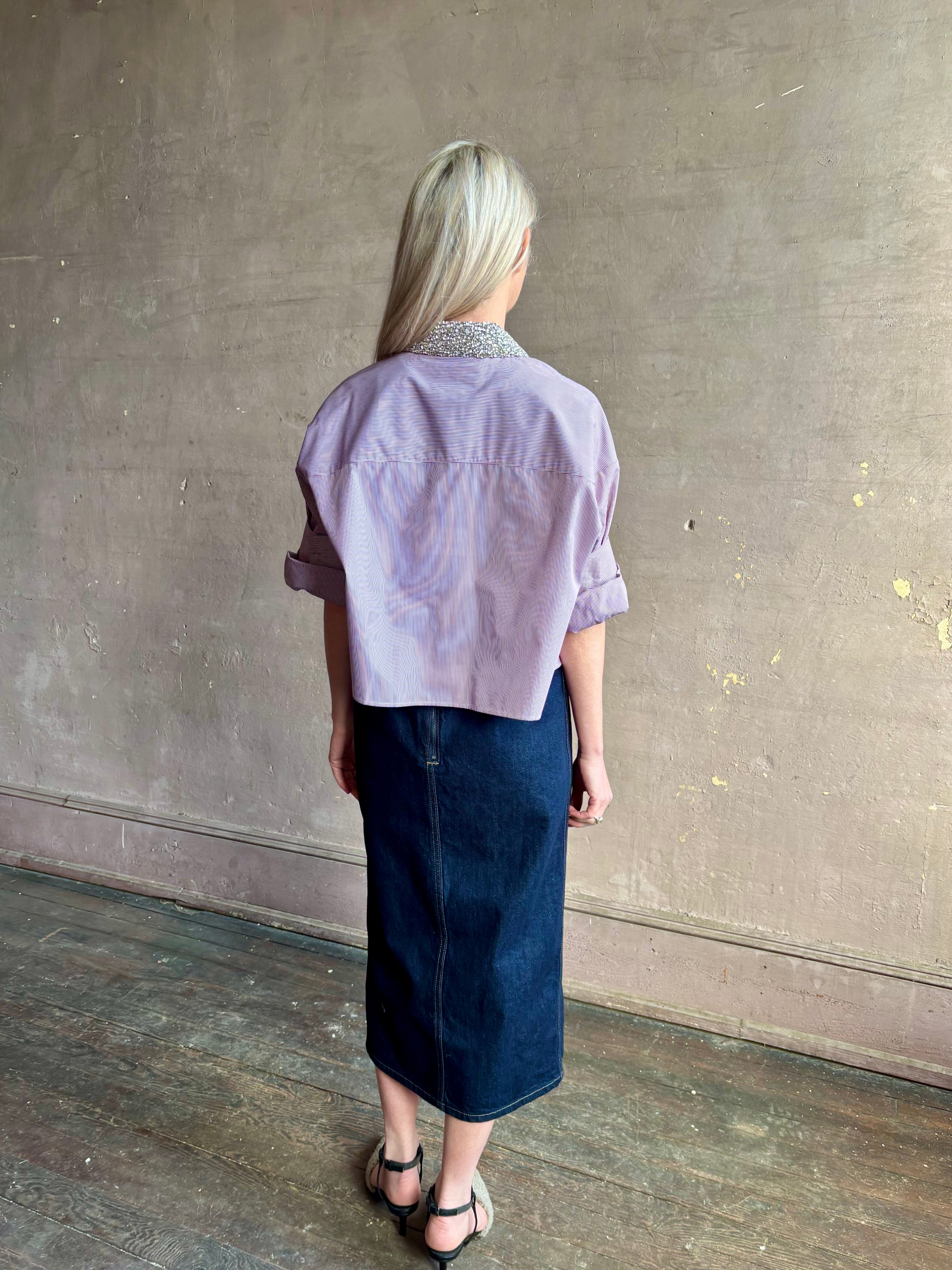 Image of mature woman wearing designer TWP Next EX cotton shirt with elevated Crystal embellished Collar in a White and wine stripe button down