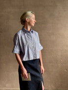 Mature woman wearing premium cotton TWP Next EX Crystal-Embellished blue and white striped Shirt with button front, collar and signature tailored cuffed sleeve detail