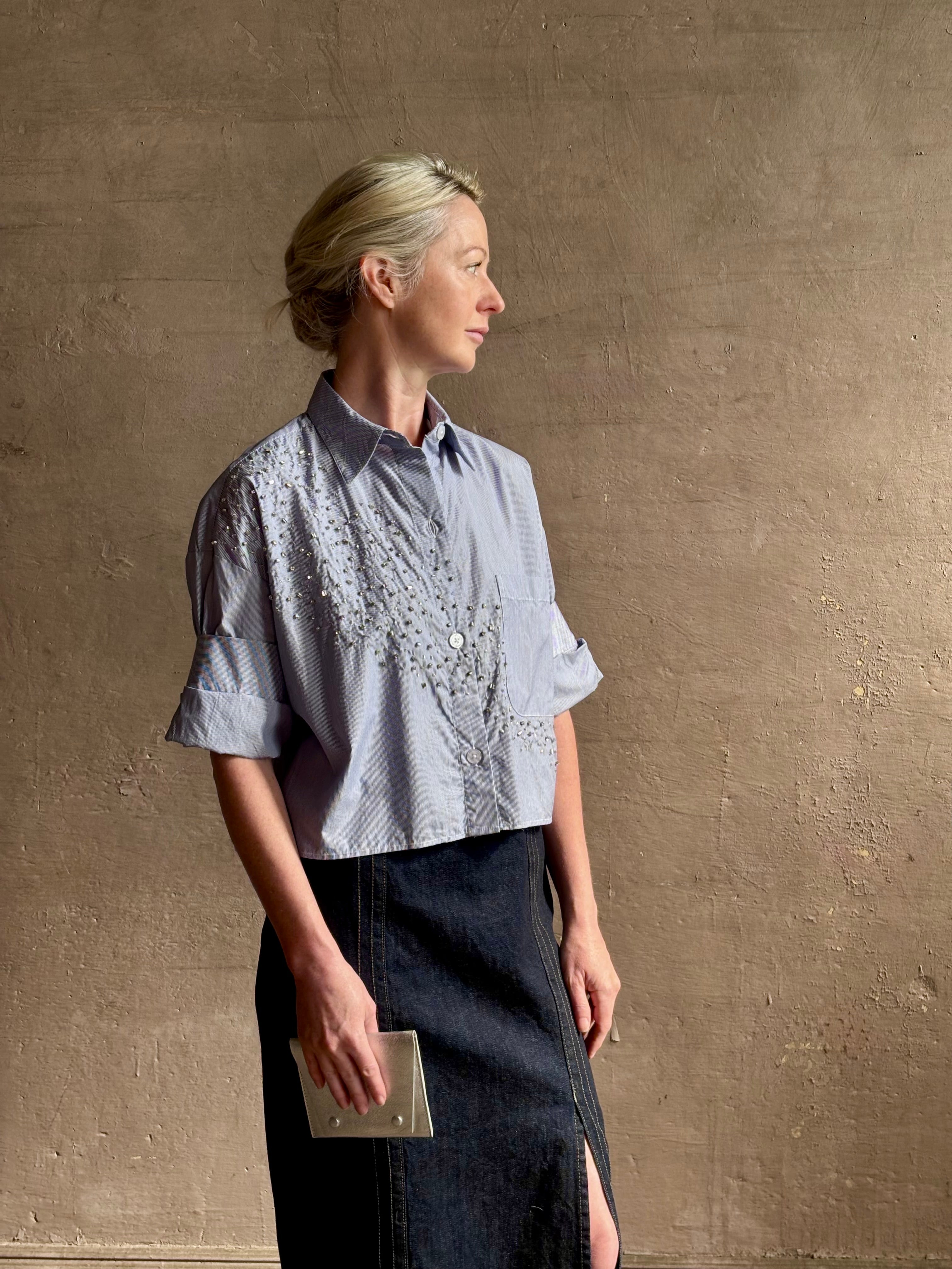 Mature woman wearing premium cotton TWP Next EX Crystal-Embellished blue and white striped Shirt with button front, collar and signature tailored cuffed sleeve detail