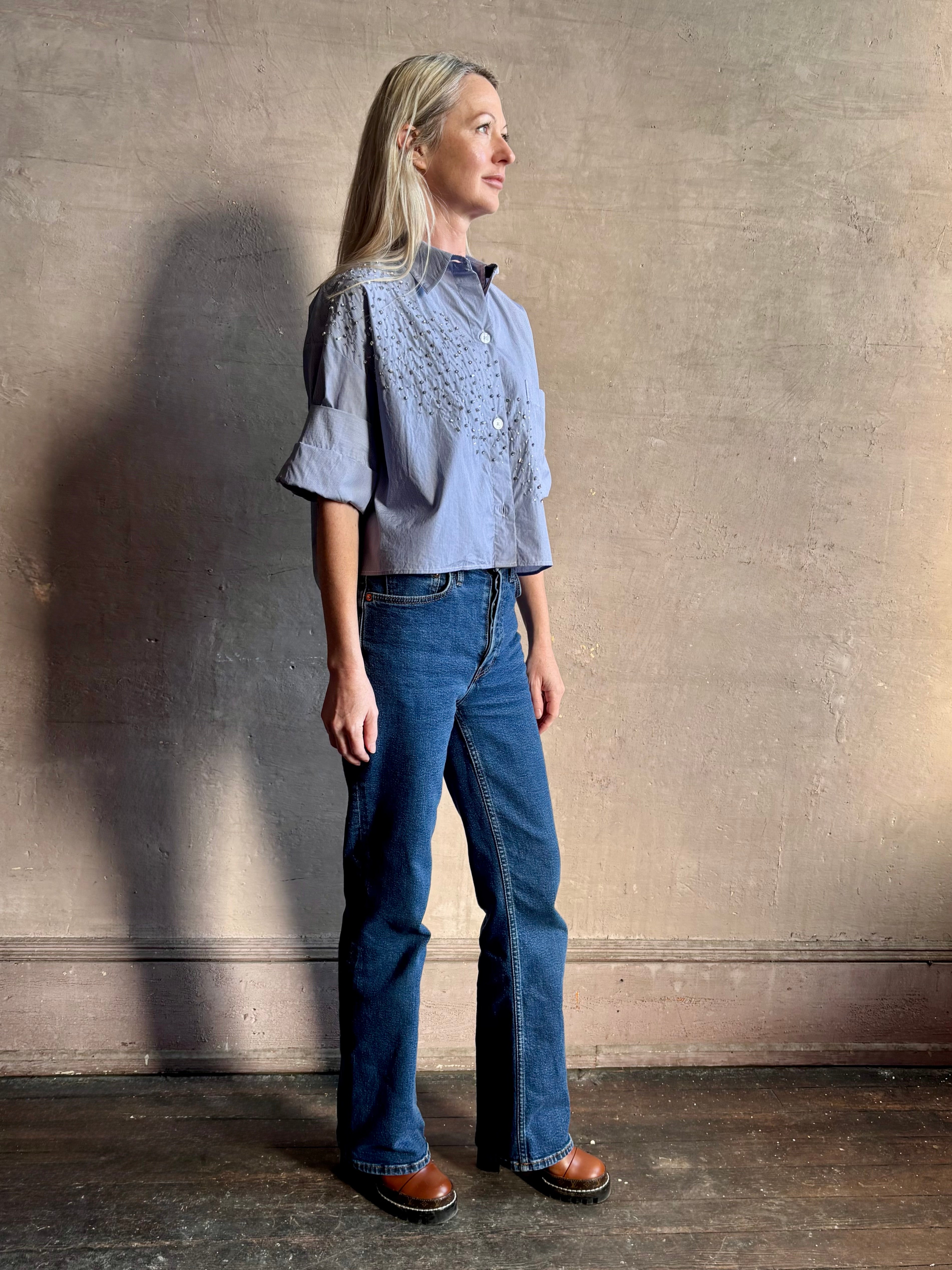 Image of woman wearing premium cotton TWP Next EX Crystal-Embellished blue and white striped Shirt