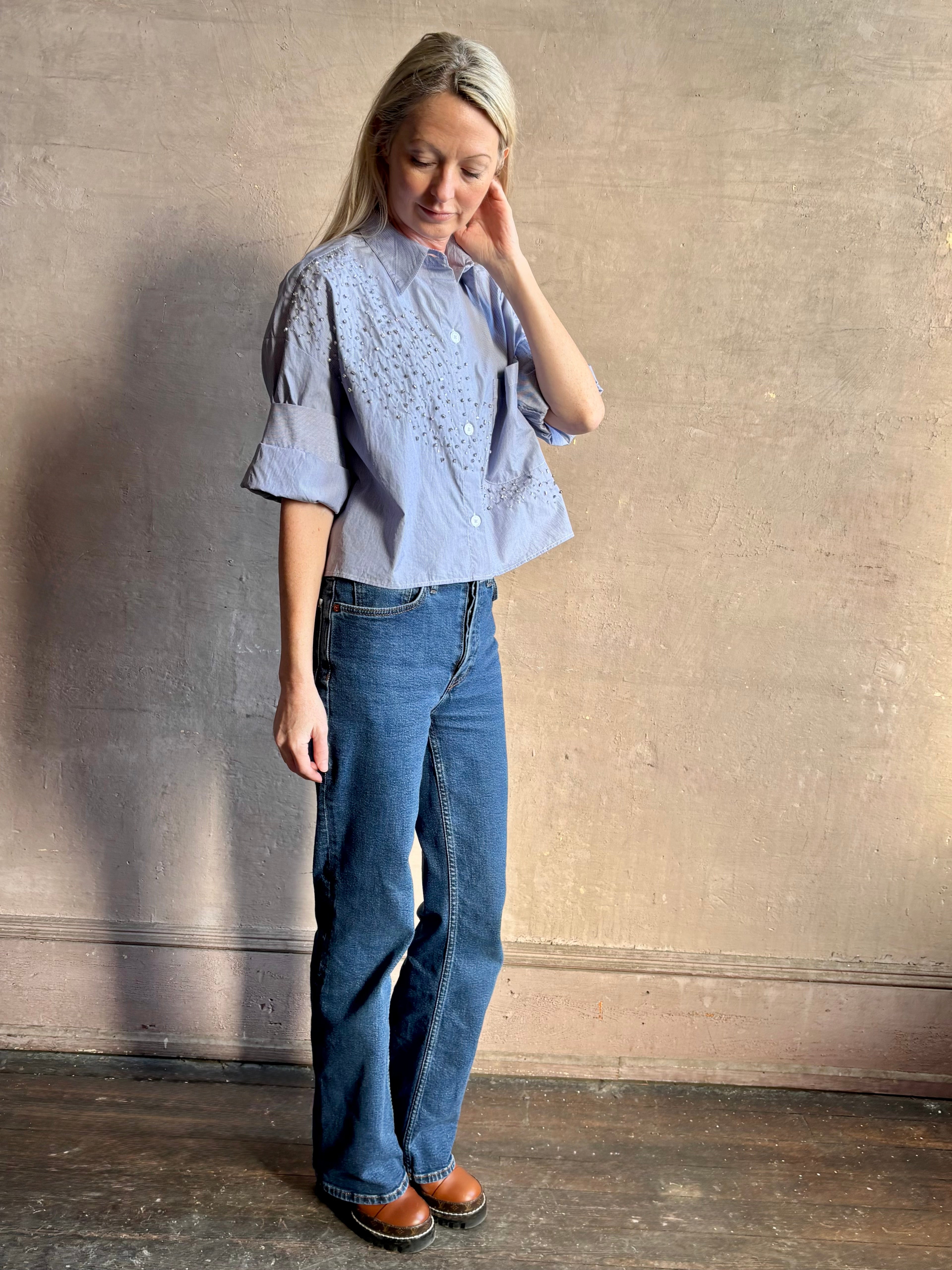 Image of woman wearing premium cotton TWP Next EX Crystal-Embellished blue and white striped Shirt