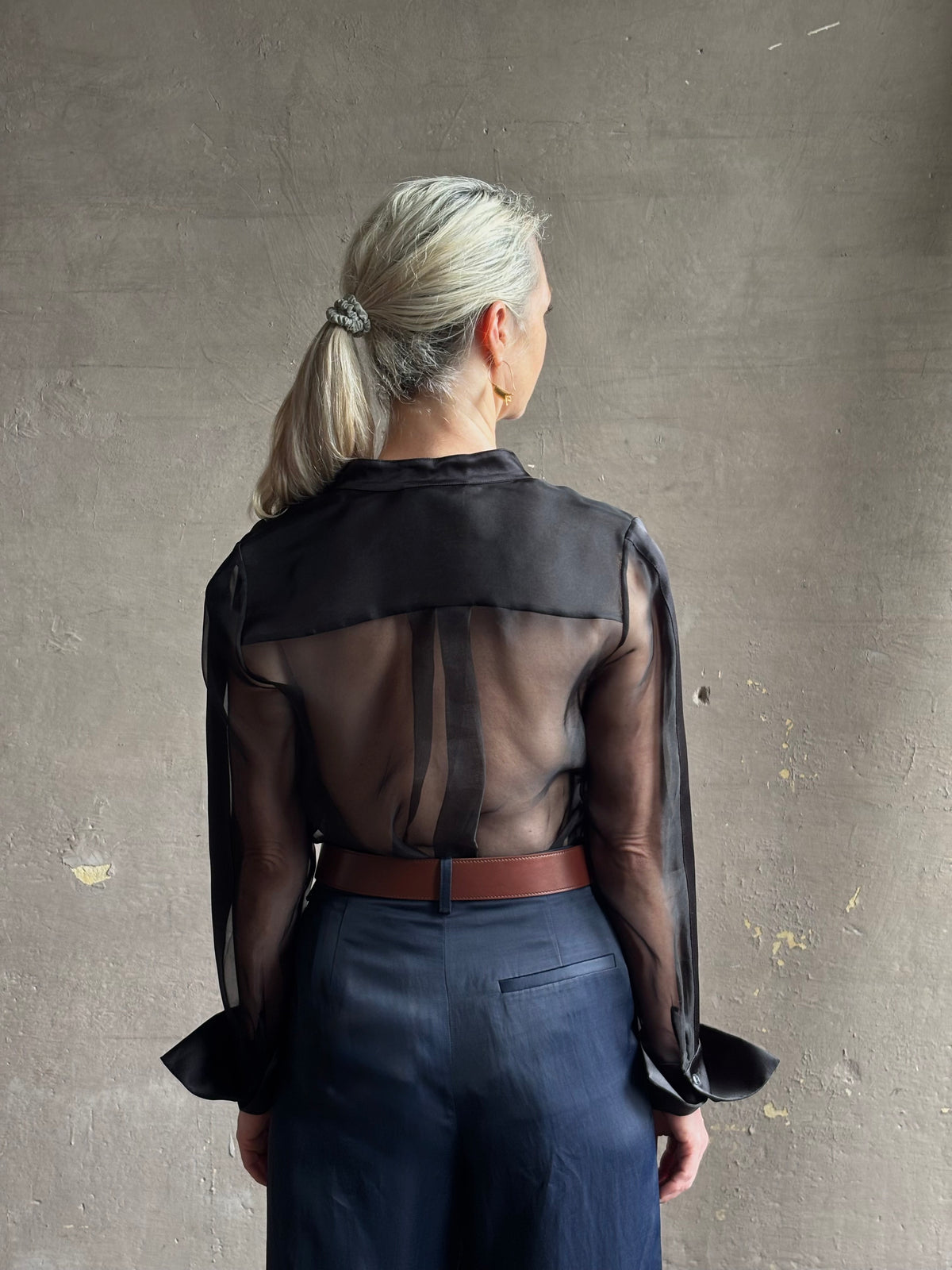Mature woman wearing TWP Peyton sheer Silk Blouse tuxedo tailored silhouette Timeless, occassion ready 