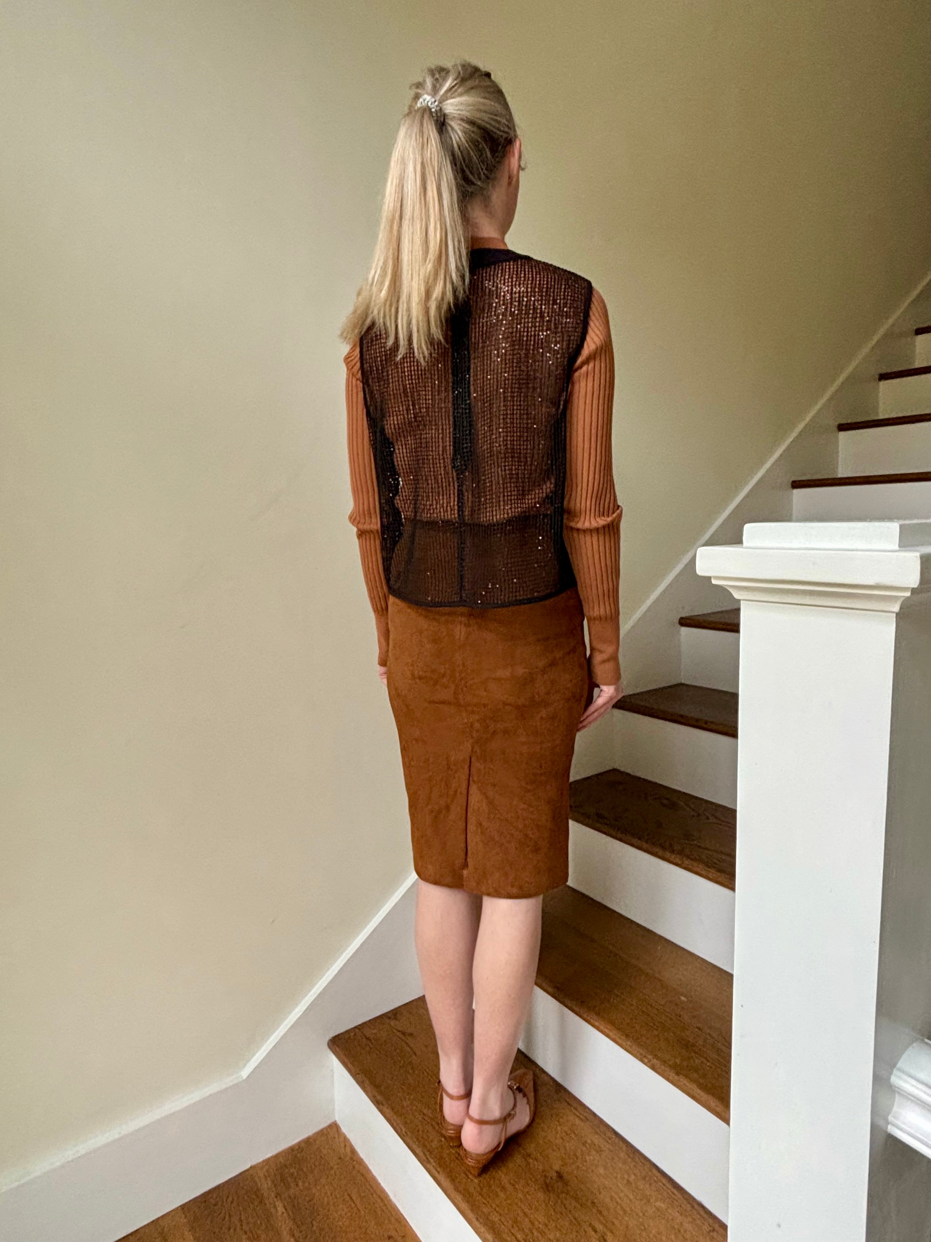 Image of mature woman wearing luxury designer TWP short muscle tank in black with subtle sequin embellishments perfect for layering 