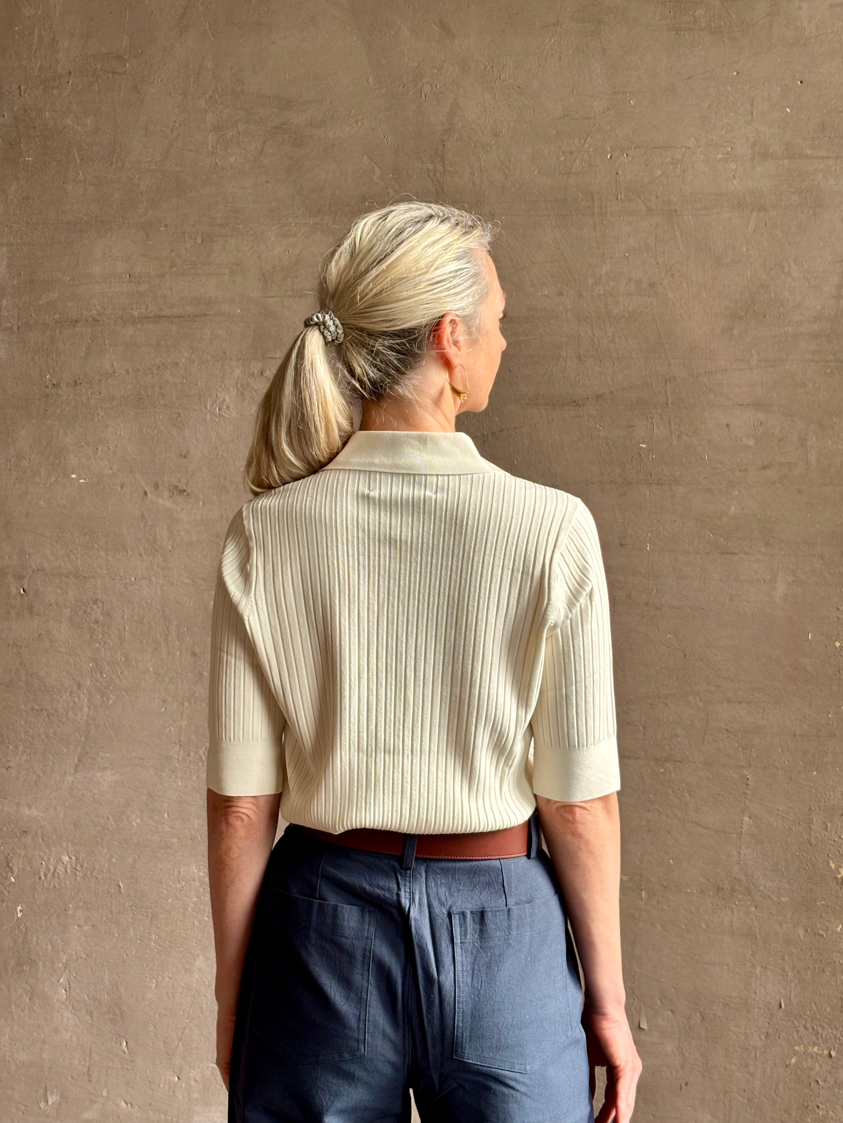 mature woman wearing quality TWP ivory short sleeve knit polo top ribbed texture collar henley 
