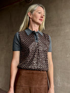 Image of woman wearing Tanya Taylor Camilla Knit top with a brown sequin floral patterned over a gray extra fine merino wool polo sweater