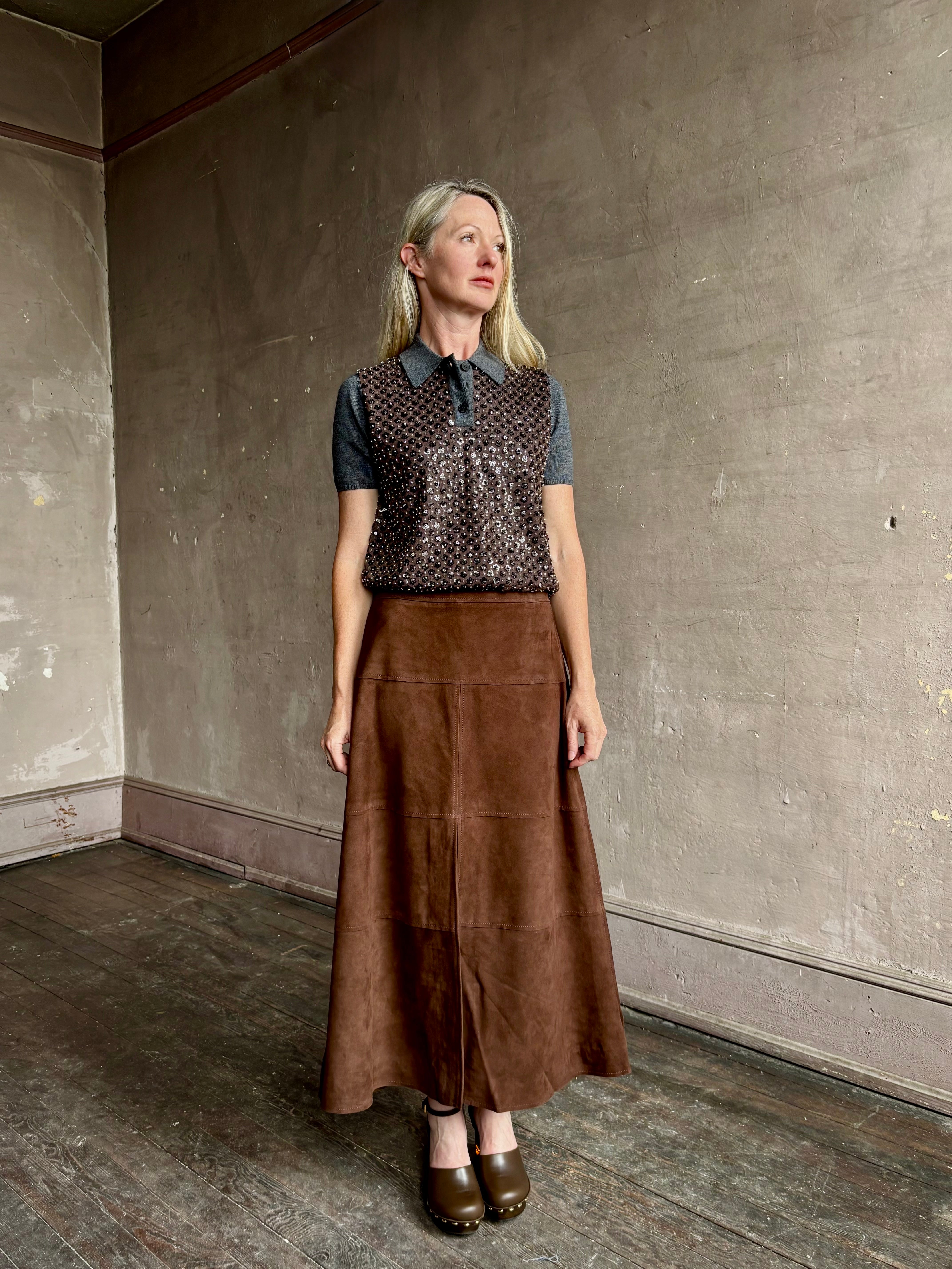 Image of woman wearing Tanya Taylor Camilla Knit top with a brown sequin floral patterned over a gray extra fine merino wool polo sweater
