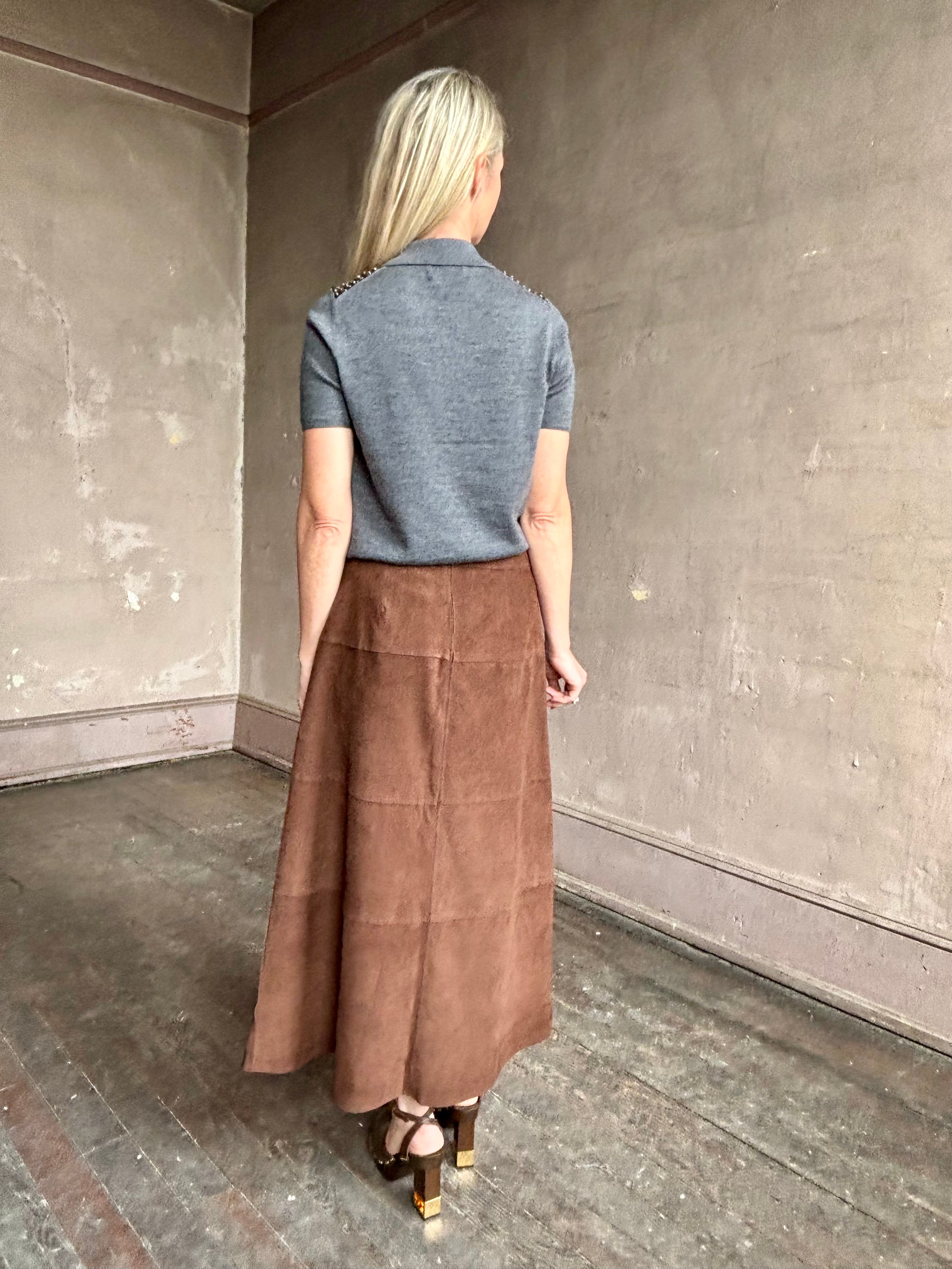 Image of woman wearing Tanya Taylor Camilla Knit top with a brown sequin floral patterned over a gray extra fine merino wool polo sweater